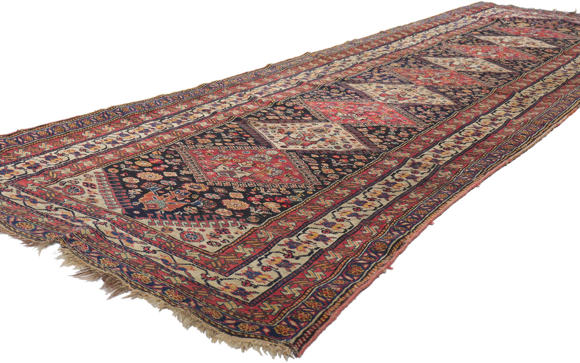 78454 Antique Persian Shiraz Runner, 03'03 x 10'11. Full of tiny details and nomadic charm, this hand knotted wool antique Persian Shiraz runner is a captivating vision of woven beauty. The eye-catching tribal design and earthy colorway woven into