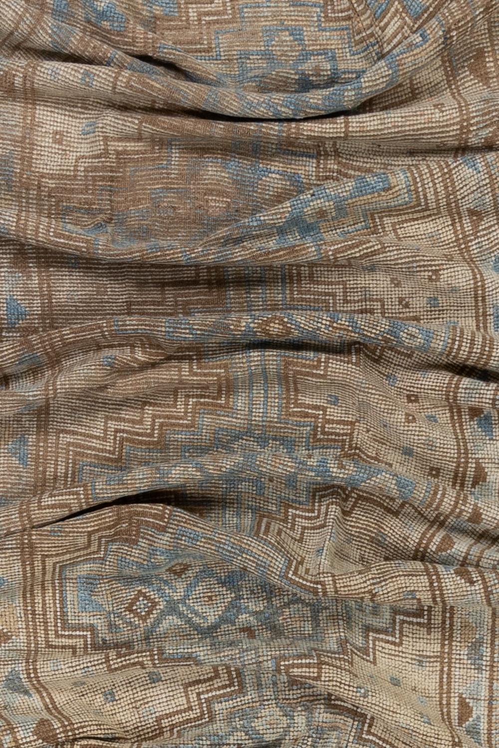Age: 120 years

Colors: tan, blue

Pile: low-medium 

Wear Notes: 3-4

Material: wool on wool

Gorgeous old wool on wool runner with a warm tan field and blue medallion. Soft underfoot and incredibly textural. 

Wear Guide:
Vintage and antique rugs