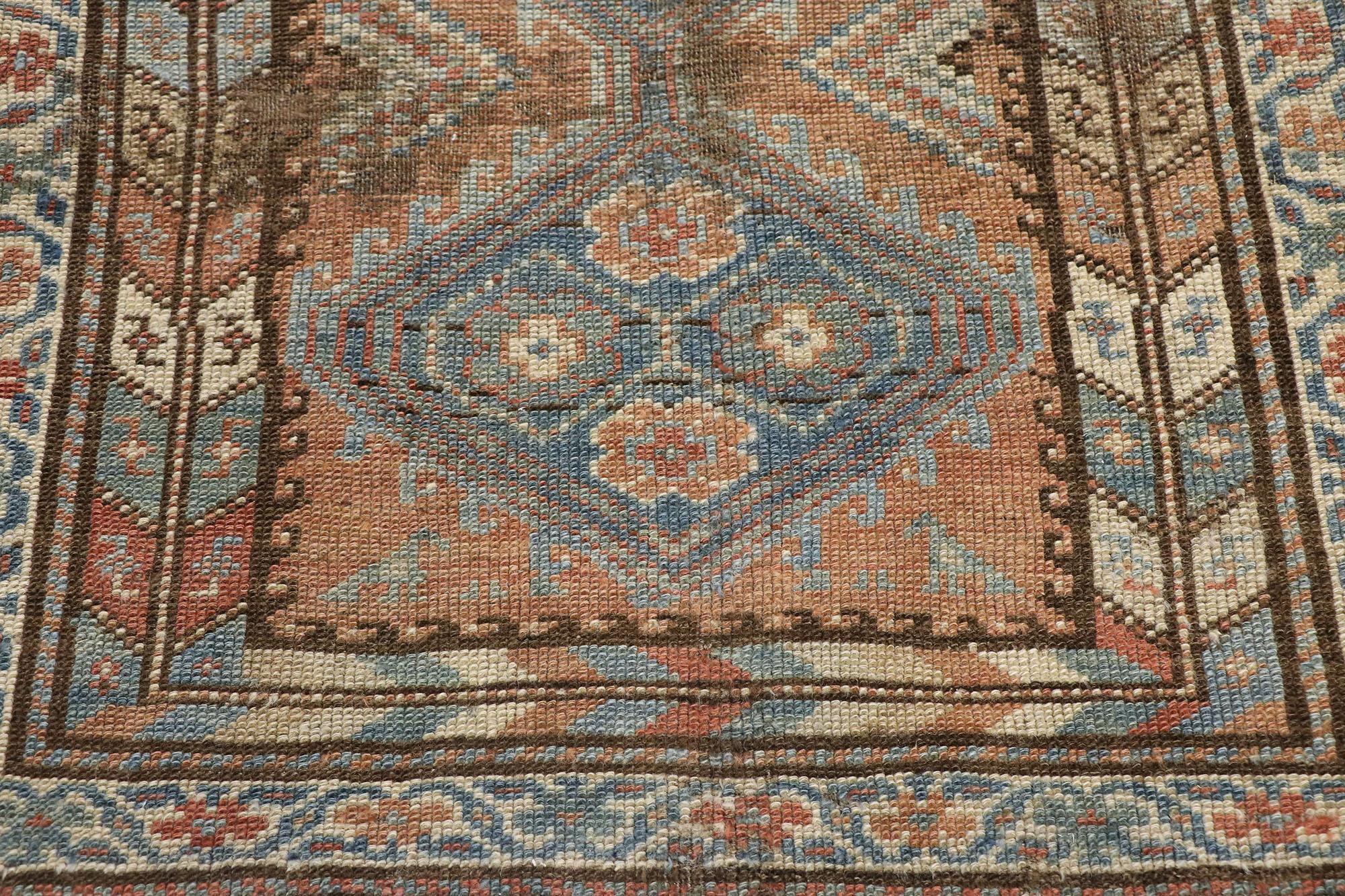 Antique Persian Shiraz Runner with Rustic Tribal Style In Distressed Condition For Sale In Dallas, TX