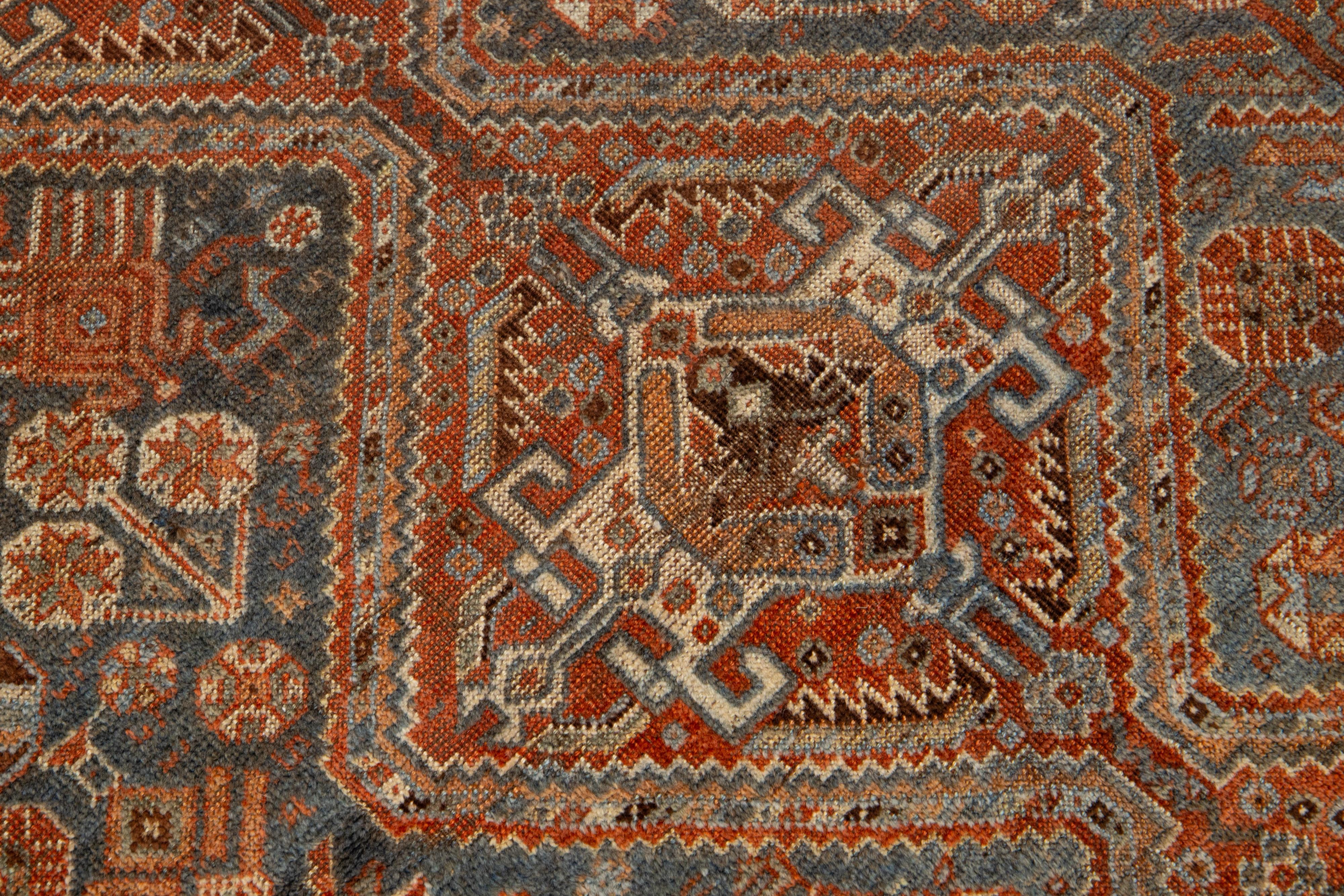 Antiker persischer Shiraz-Wollteppich in Rost & Blau mit Allover-Design (20. Jahrhundert) im Angebot