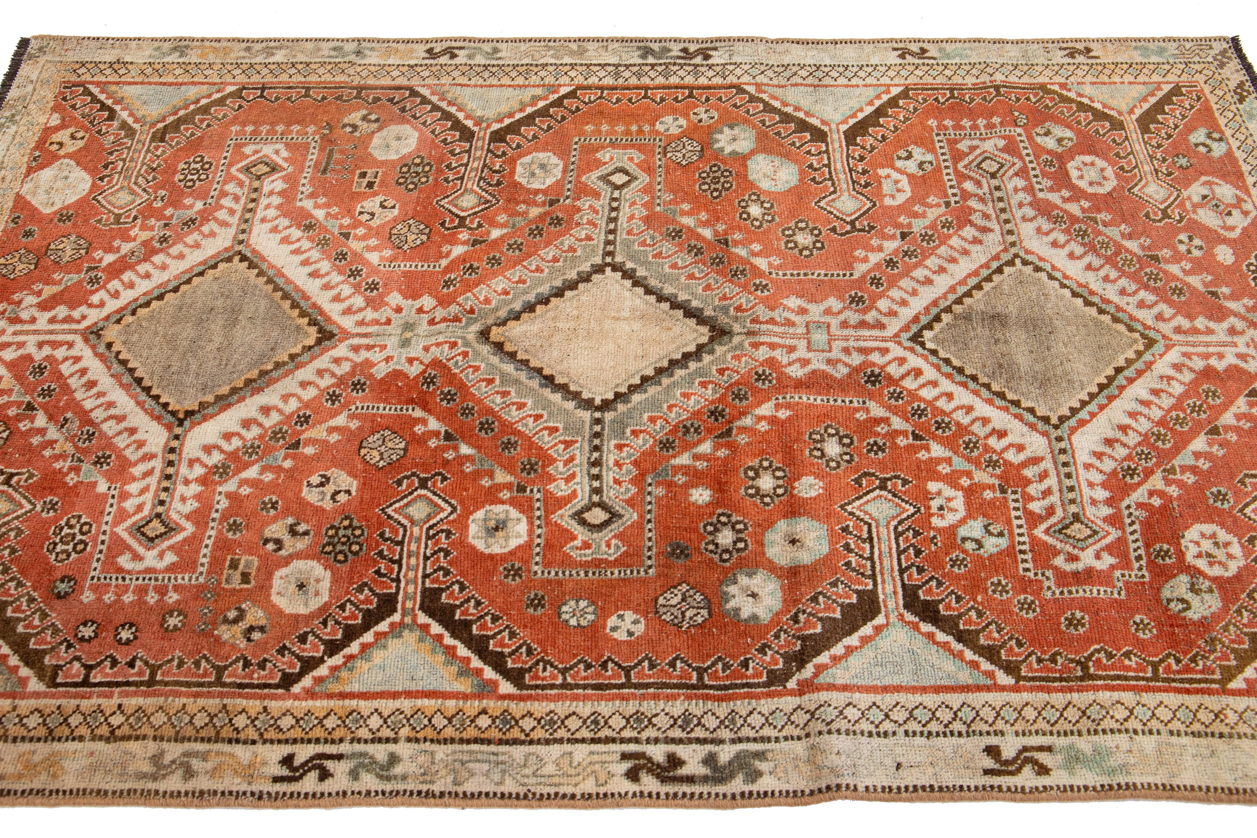 Hand-Knotted Antique Persian Shiraz Rust- Orange Wool Rug With Tribal Design For Sale