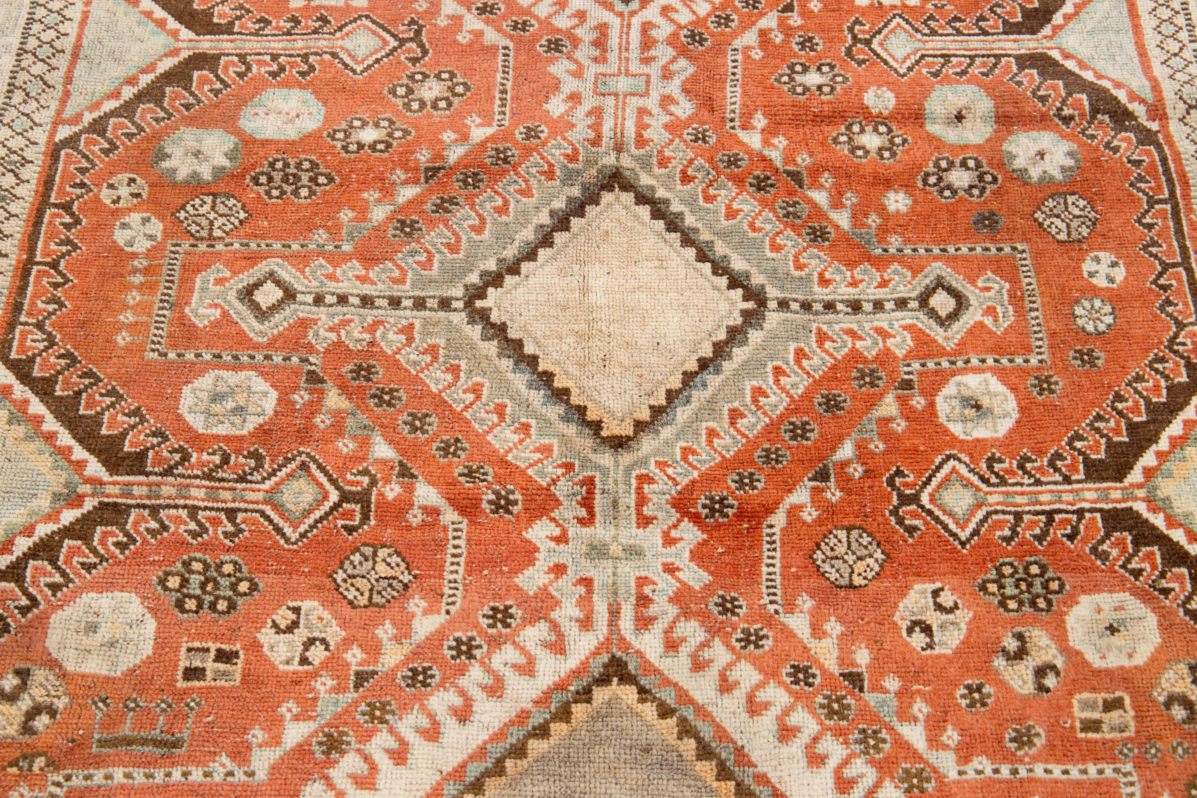 20th Century Antique Persian Shiraz Rust- Orange Wool Rug With Tribal Design For Sale