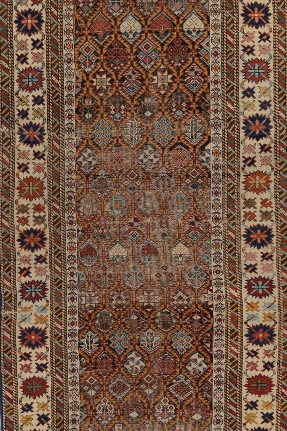 Circa 100 years
Pile: Low
Exquisitely detailed antique Shirvan with signature.
Wear Notes: 4

Wear Notes:
Vintage and antique rugs are by nature, pre-loved and may show evidence of their past. There are varying degrees of wear to vintage rugs; some