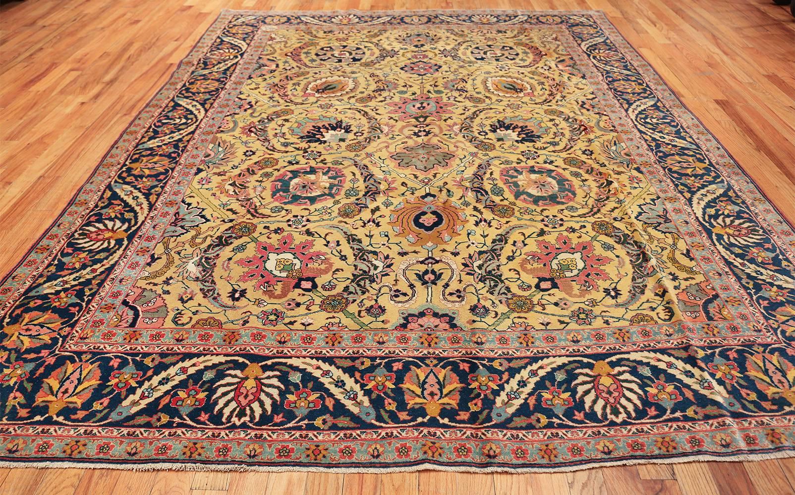 Antique Persian sickle leaf Tabriz rug, country of origin: Persia, date: circa early 20th century. Size: 9 ft x 12 ft (2.74 m x 3.66 m)

The well-executed curvilinear floral motifs of this Tabriz rug suggest a high knot count that allows a fluid