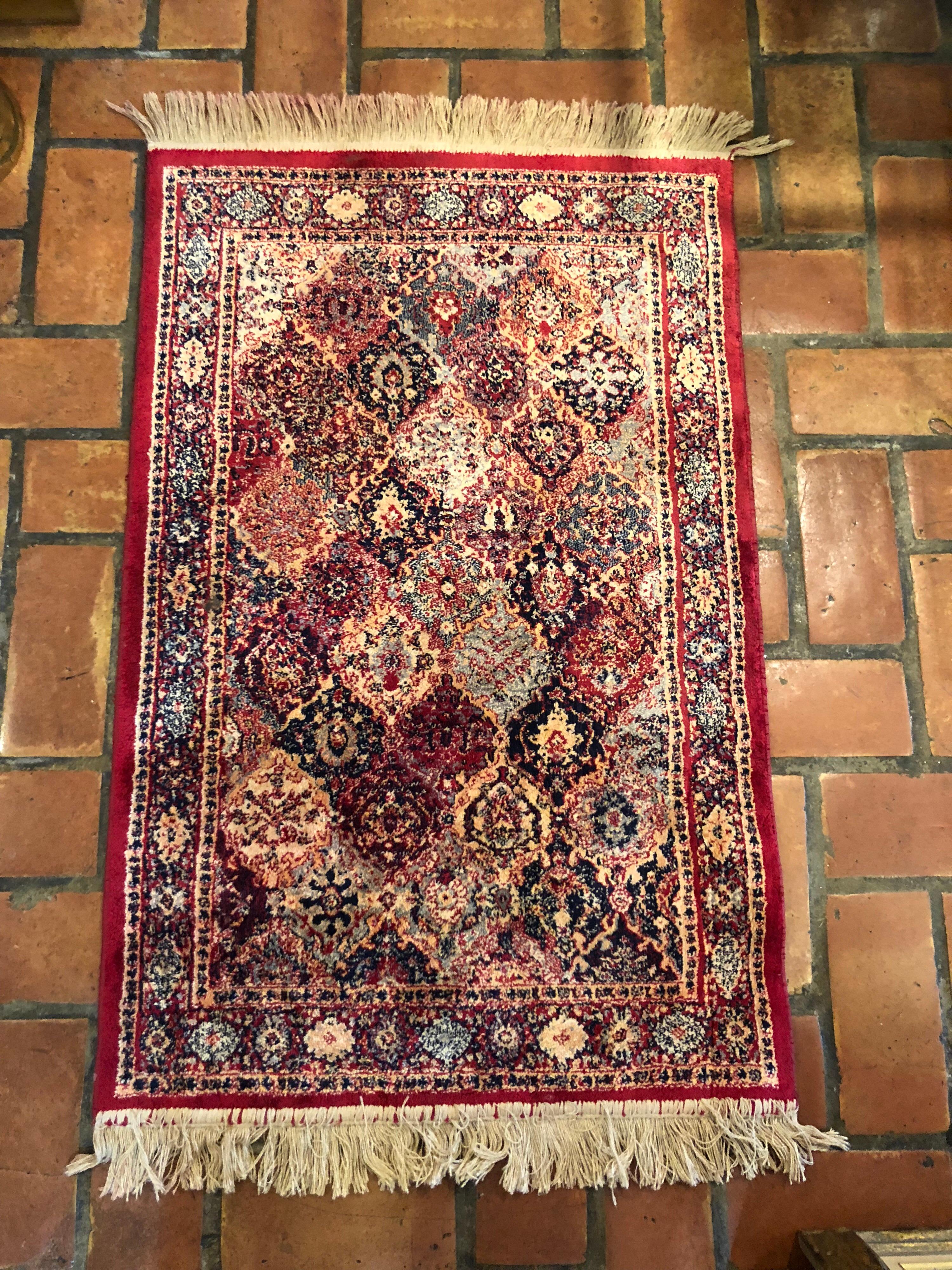 Antique Persian silk prayer mat. Deep rich magenta tones with creams and blues. Hand knotted and adorned with fringe. dimensions are :26