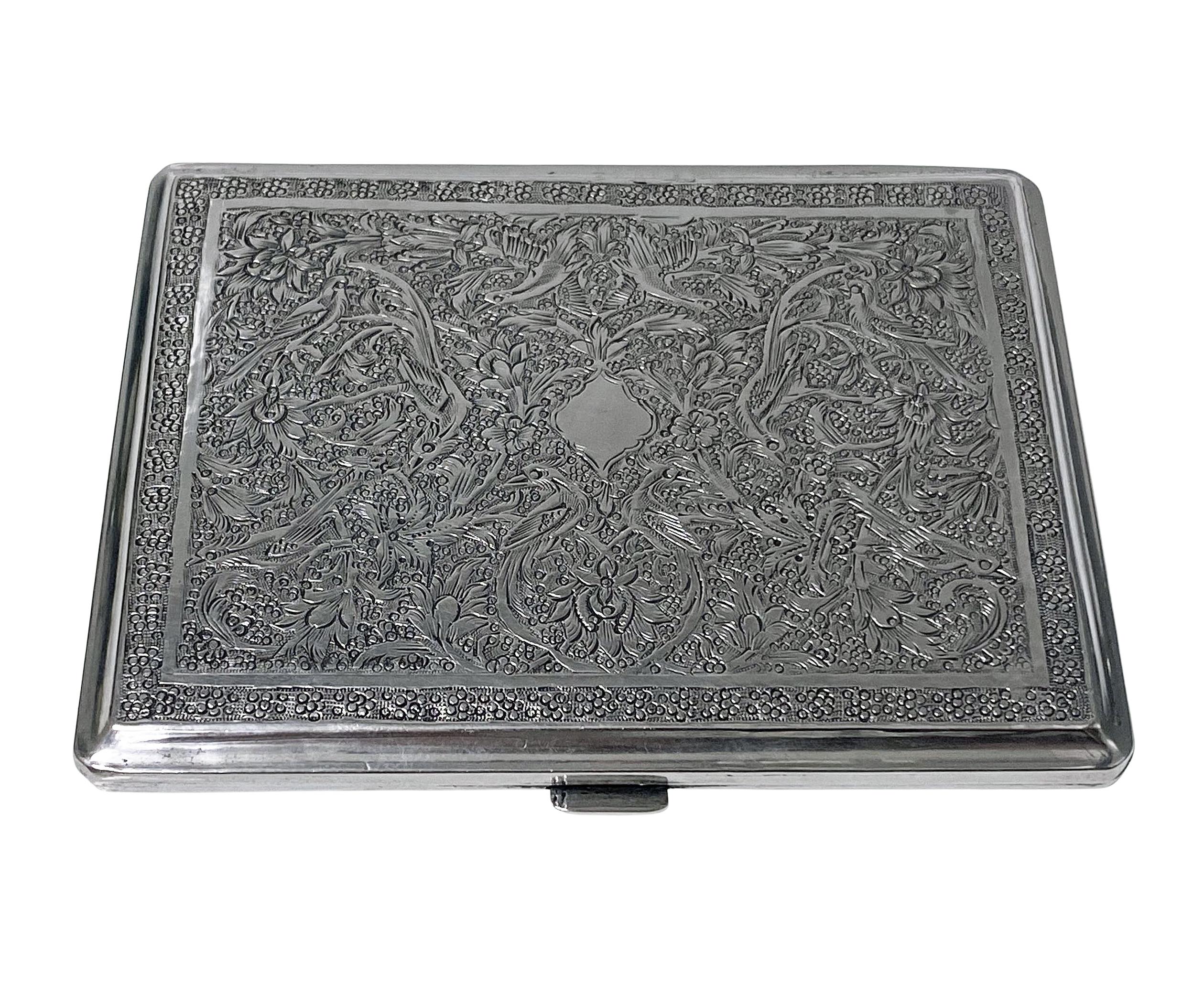 Antique Persian silver cigarette case C.1920. The case beautifully chased, engraved and decorated with birds, animals and foliage. Persian marks to interior. Material band worn. Measures: 4.00 x 3.125 x 0.25 inches. Weight: 128.62 grams.
 