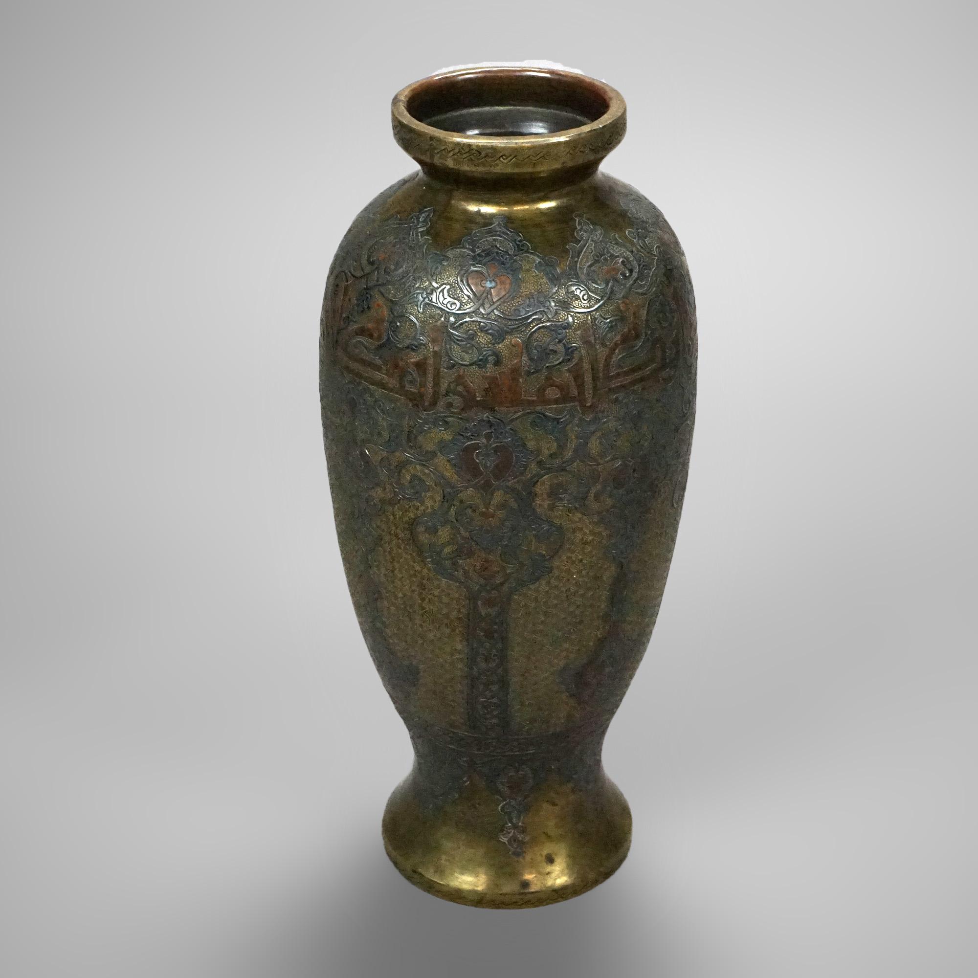An antique Persian vase offers silver and copper inlay with foliate and floral design in bronze vessel, stamped as photographed, 18-19th C

Measures- 11.75'' H x 5'' W x 5'' D.