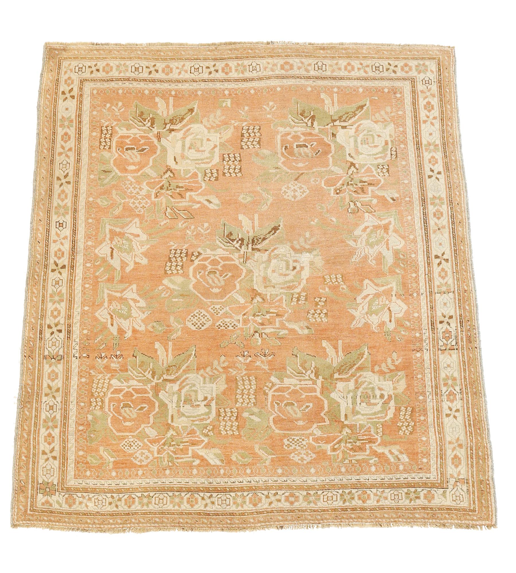 Antique Persian Sirjan rug handwoven from the finest sheep’s wool and colored with all-natural vegetable dyes that are safe for humans and pets. It’s a traditional Sirjan design featuring floral details in ivory and green over a pink field. It’s an