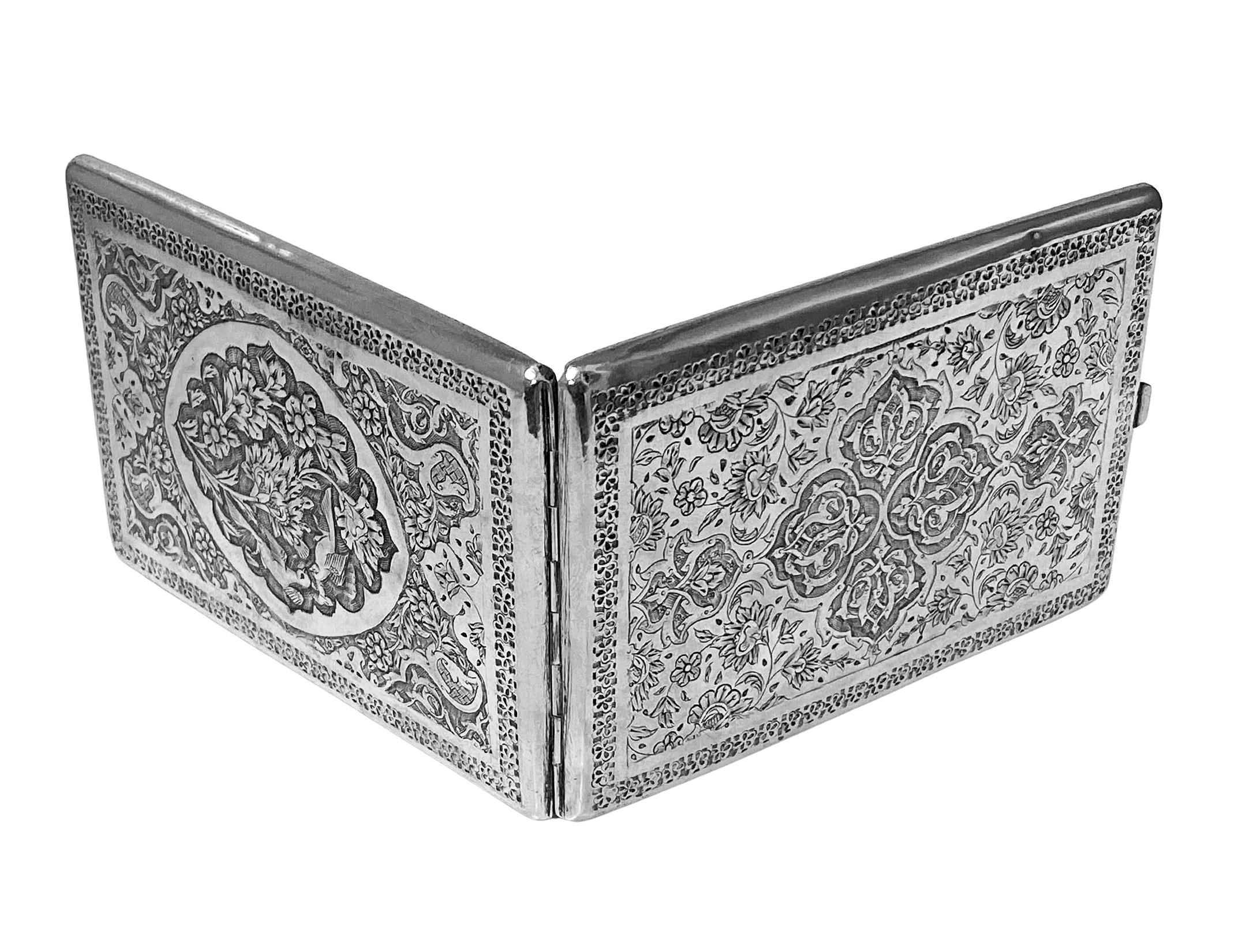 Antique Persian solid silver cigarette case C.1900 maker’s mark possibly Aghazadian. The front and reverse of case with beautiful chased and engraved birds and flowers design. Interior marks possibly for Aghazadian. Measures: 4.50 x 3.00 inches.