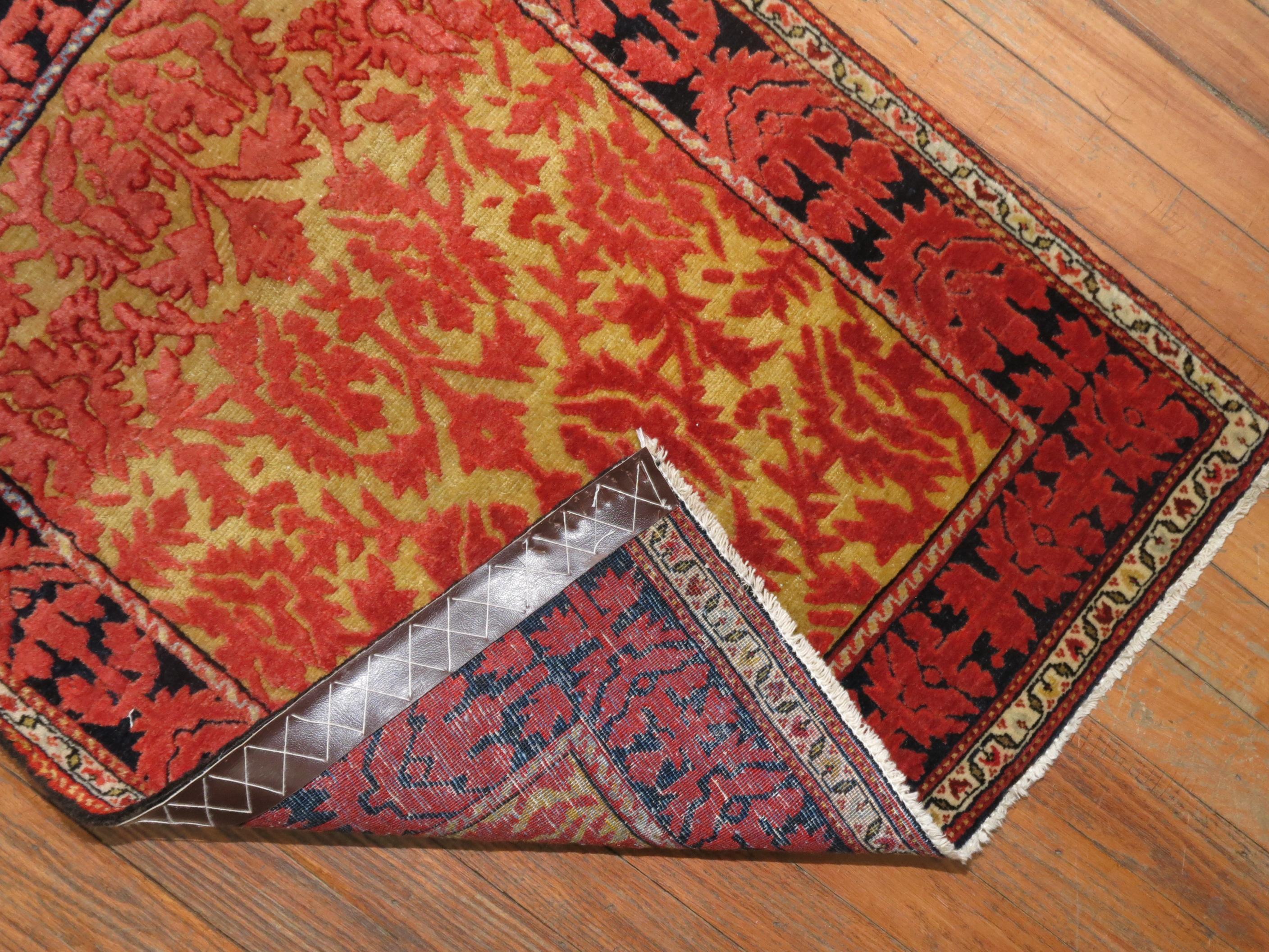 An early 20th century Persian Souf carpet. Possibly Jozan Region. Has characteristics from farahan region as well. Stunning goldenrod and rich red jewel tones.

Measures: 2'1'' x 2'8''

Souf rugs are very rare technique found as they have a