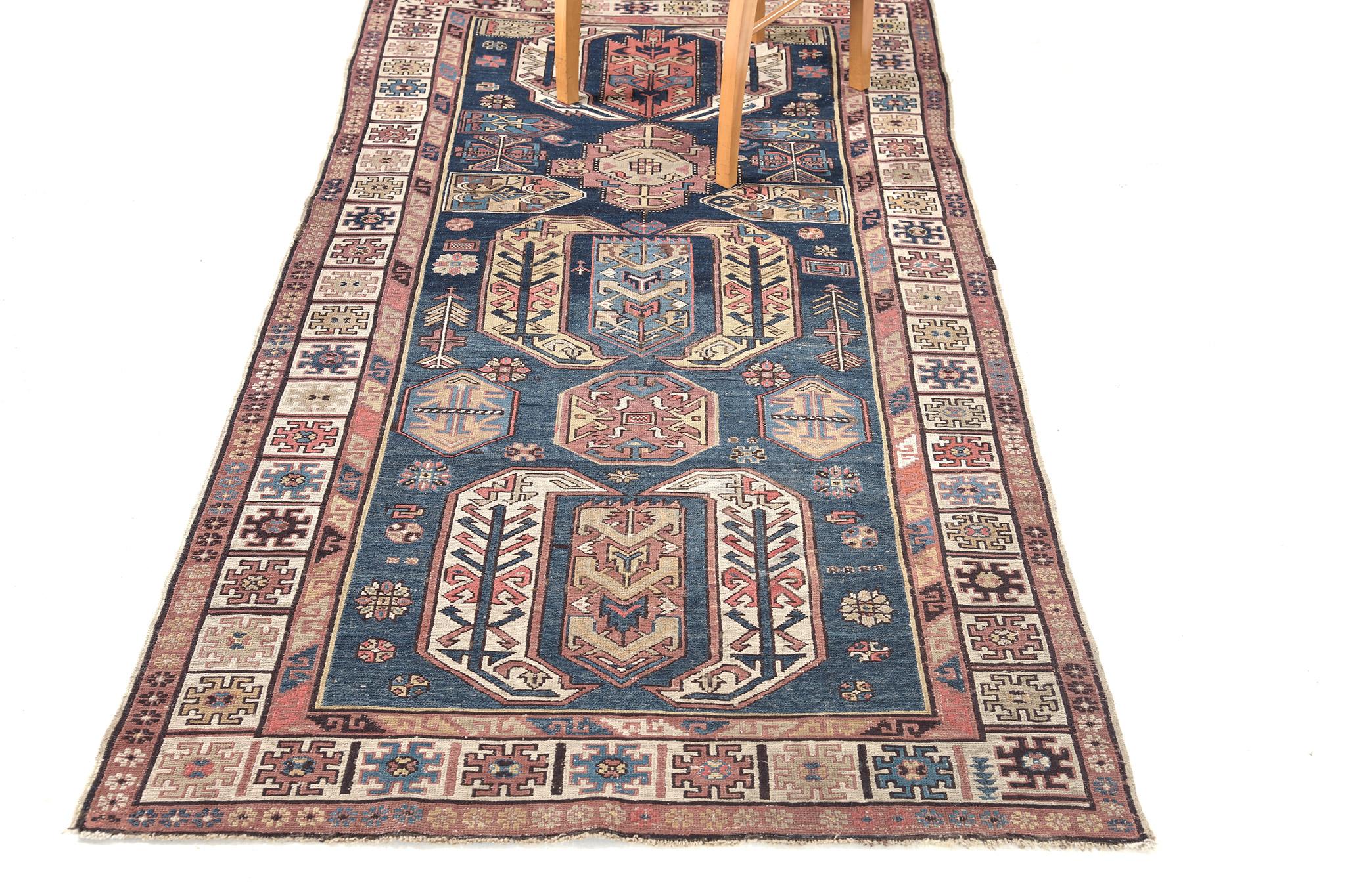 This Antique Persian Soumak features three symbollical medallions spread throughout the abrashed aegean blue field. The gorgeous color palette based around distinctive tones gives the piece a remarkable captivating feel. In combination with its bold