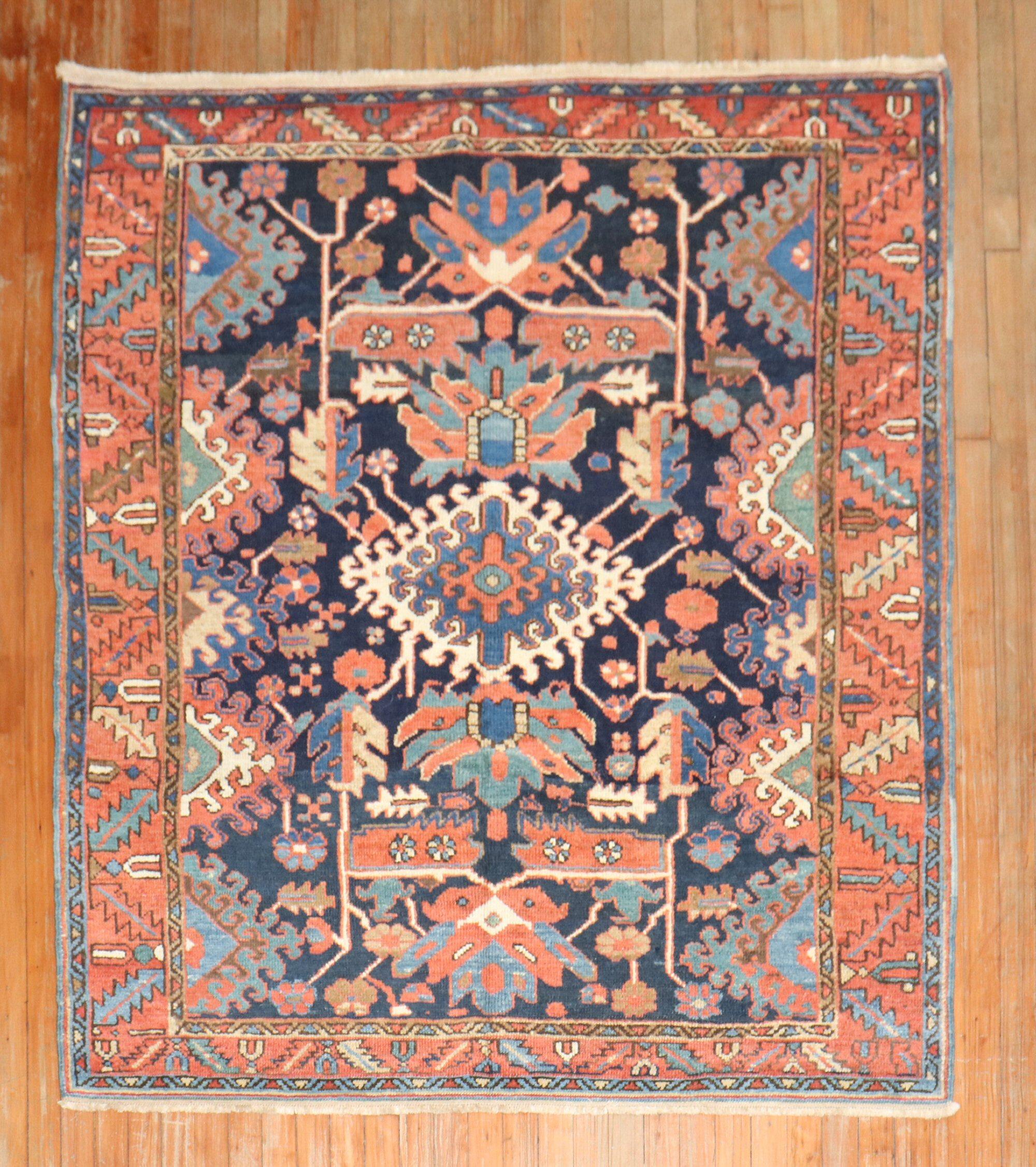 An early 20th century traditional navy blue field Persian Heriz carpet with a geometric all over design.

Measures: 5'x 5'8