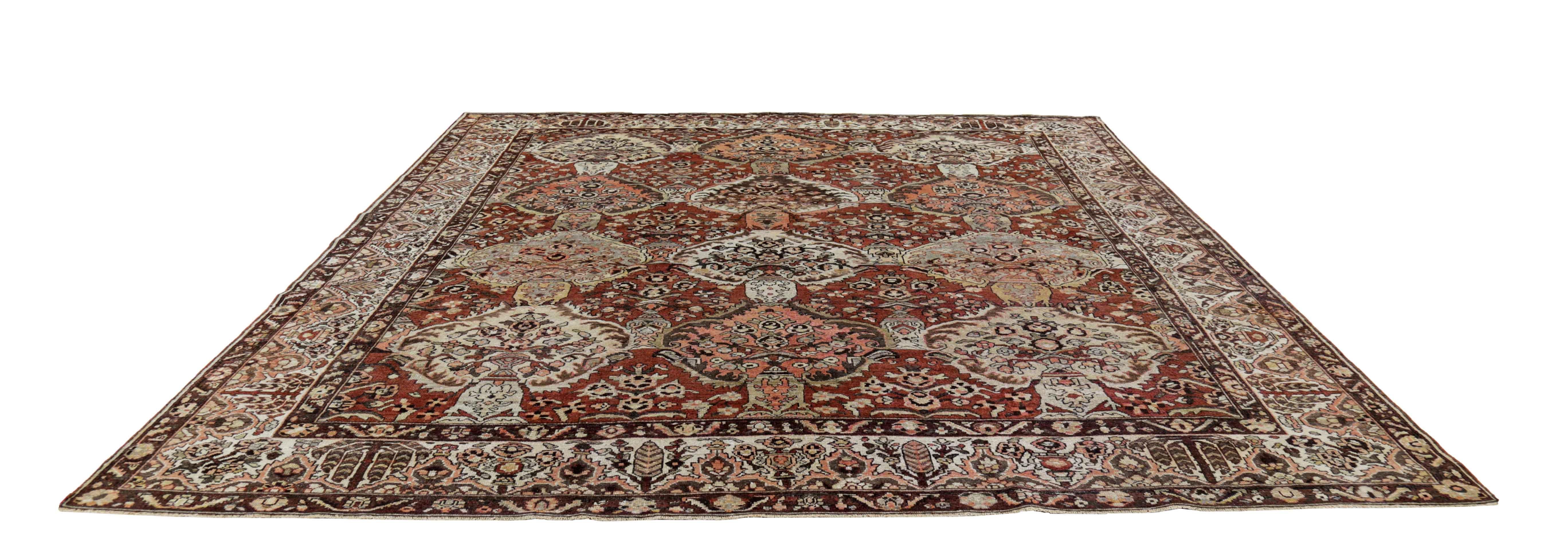 Antique Persian square rug handwoven from the finest sheep’s wool. It’s colored with all-natural vegetable dyes that are safe for humans and pets. It’s a traditional Bakhtiar design handwoven by expert artisans. It’s a lovely square rug that can be