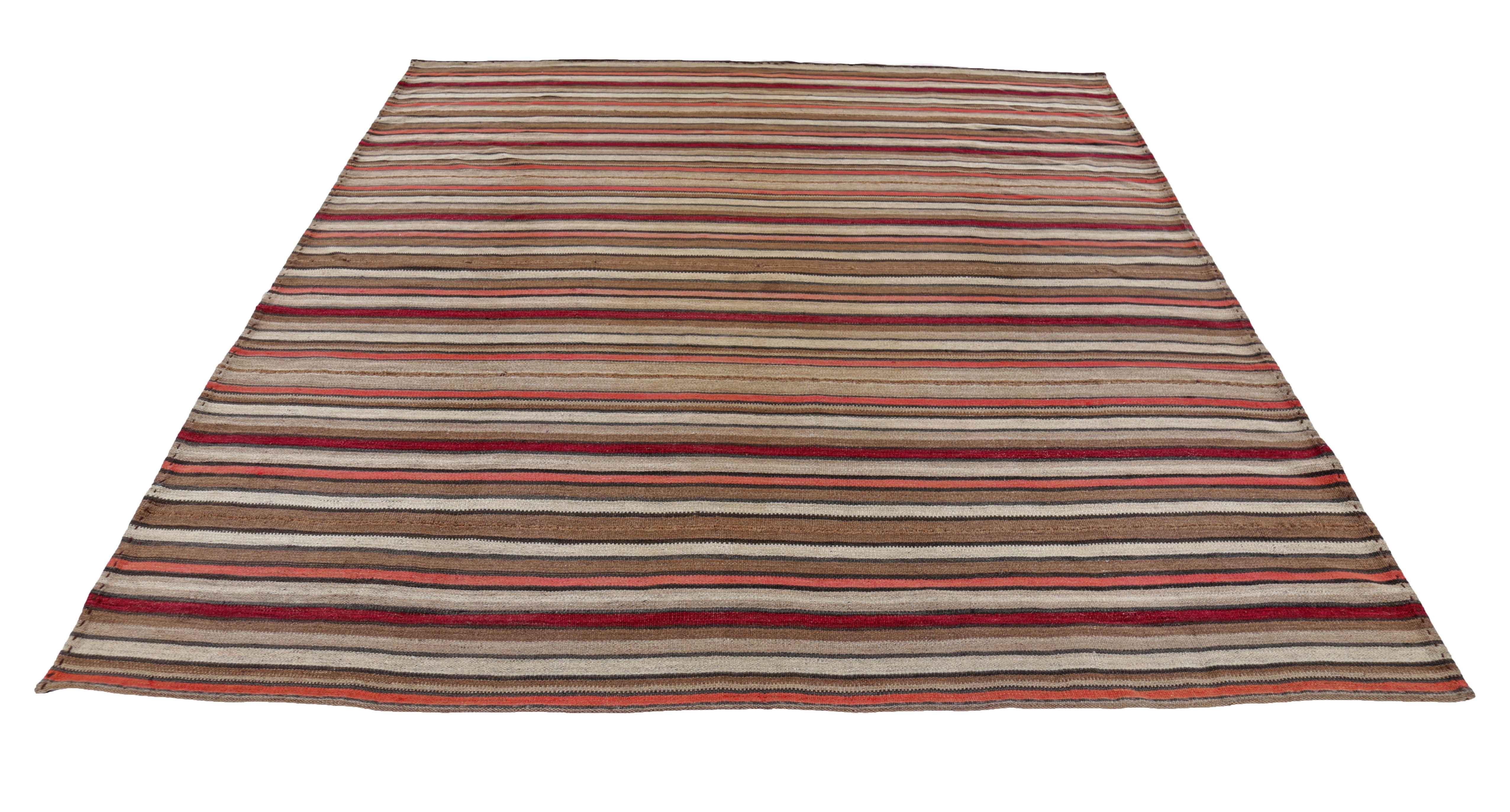Antique Persian square rug handwoven from the finest sheep’s wool. It’s colored with all-natural vegetable dyes that are safe for humans and pets. It’s a traditional Kilim design handwoven by expert artisans. It’s a lovely square rug that can be