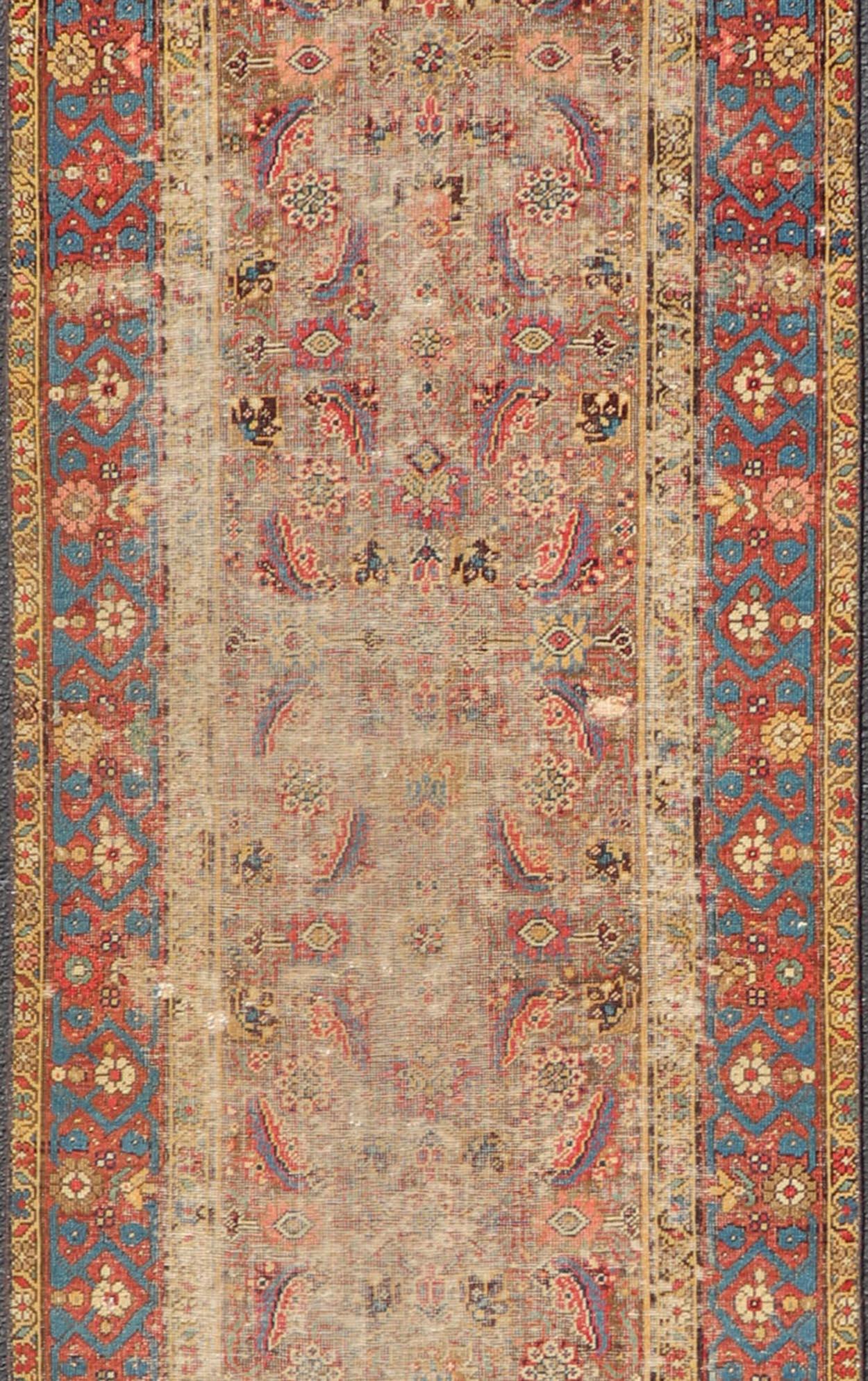 Antique Persian Sultanabad Distressed Runner with Floral Design in Jewel Tones In Fair Condition In Atlanta, GA