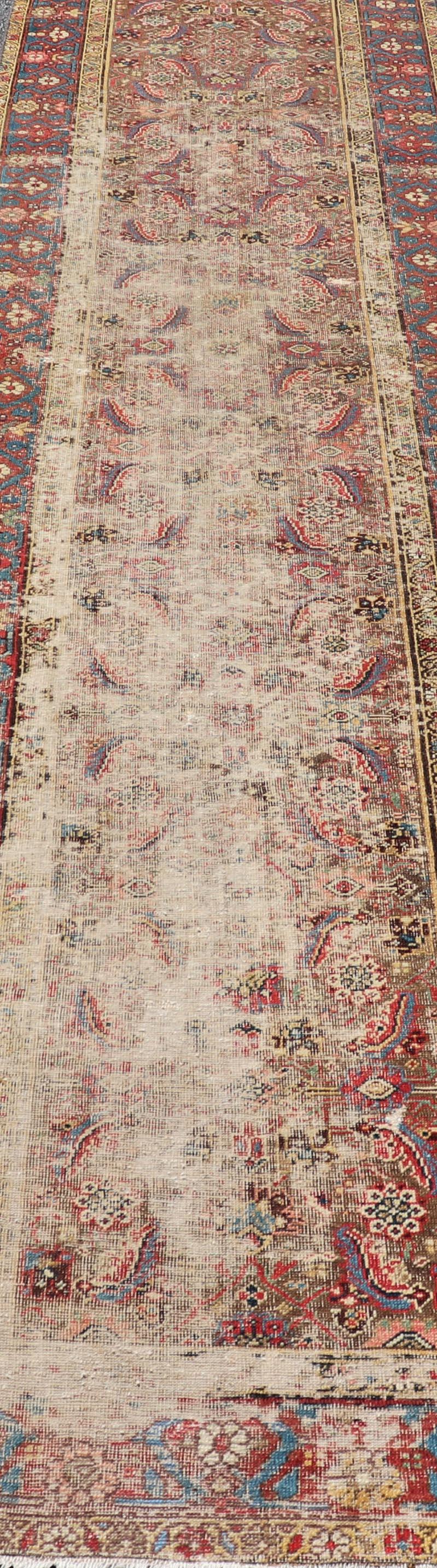 Wool Antique Persian Sultanabad Distressed Runner with Floral Design in Jewel Tones For Sale