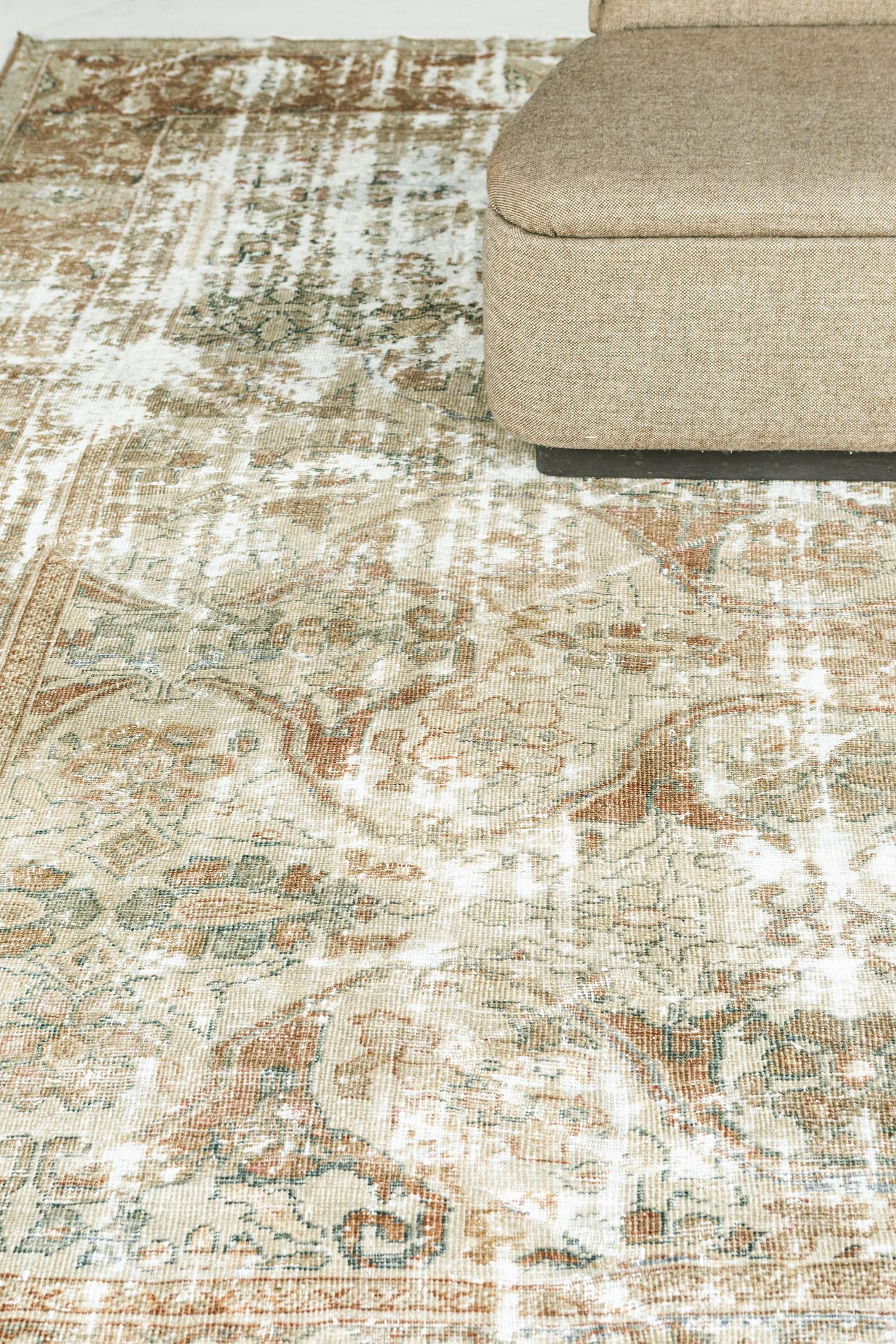 A antique Persian Sultanabad with beautiful vine work in the perfect distressed finish. Luxurious wools in various neutrals create a cohesive and timely design. Sultanabad in northwest Iran (current day Arak), was a prominent center of village and