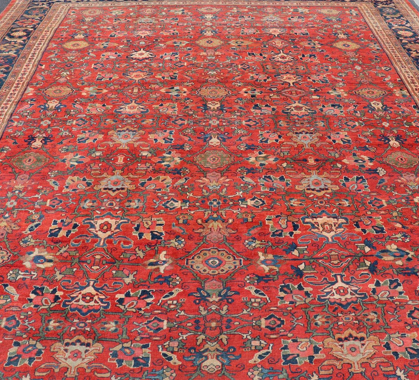 Antique Persian Sultanabad in Rust Red Background & Multi Colors 14'2 x 18'6 In Good Condition For Sale In Atlanta, GA