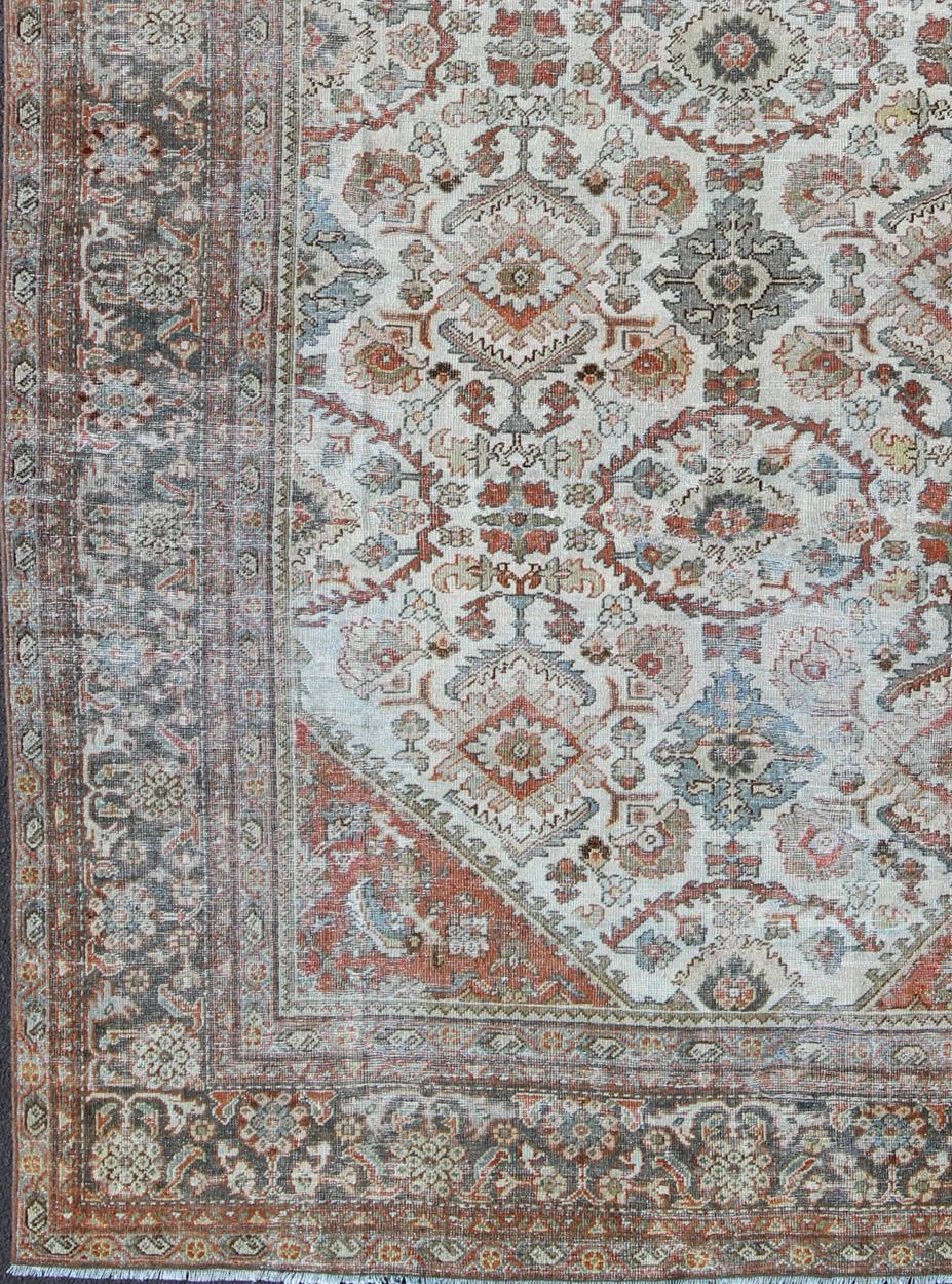 Antique Persian Sultanabad-Mahal rug with ivory, terracotta red, light blue, charcoal sub-Geometric floral design, rug dsp-ca878, country of origin / type: Iran / Sultanabad-Mahal, circa 1910.

This beautiful antique Persian Sultanabad-Mahal rug