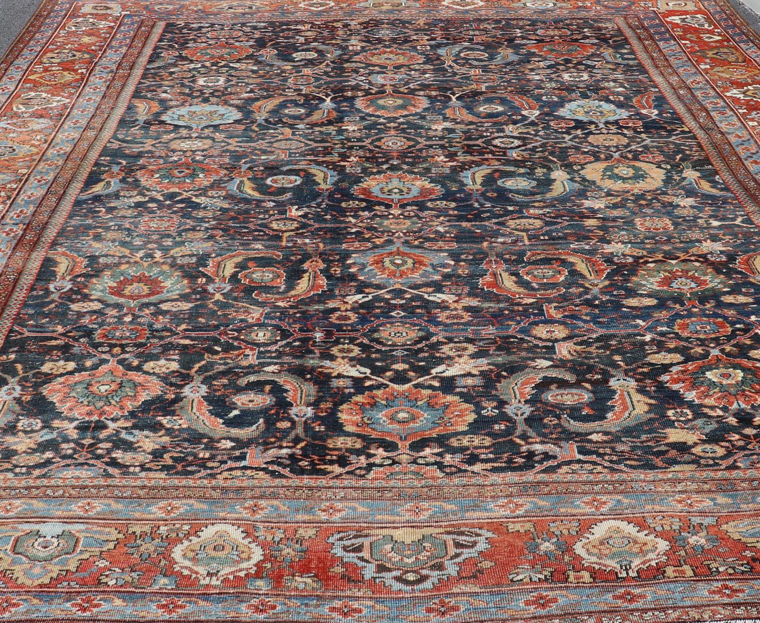 Measures: 13'9 x 18'0 
Antique Persian Sultanabad-Mahal Rug with Dark Navy Field 13'9 x 18'0 Keivan Woven Arts /  rug W22-1103, country of origin / type: Iran / Sultanabad, circa 1880s
This antique Persian Sultanabad Mahal rug (circa 1880s) relies