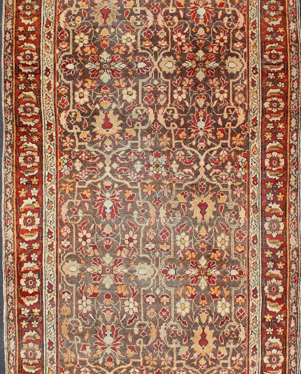 Antique Sultanabad short gallery rug with colorful, bold design, rug 19-0602, country of origin / type: Iran / Mahal, circa 1900

This antique Persian Sultanabad carpet features Colors such as Gray, soft Orange red, mauve, brown, ivory, cream, soft