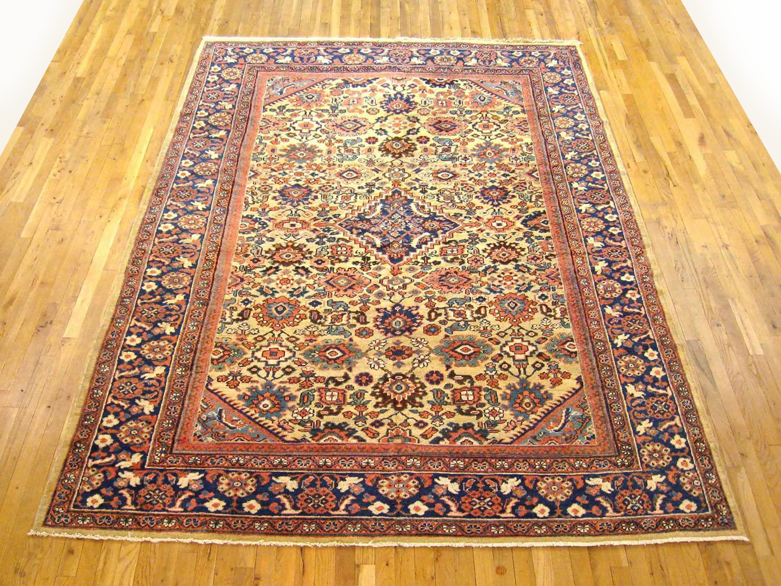 Antique Persian Sultanabad rug, Room size, circa 1920

A one-of-a-kind antique Persian Sultanabad oriental carpet, hand-knotted with short wool pile. This gorgeous hand-knotted wool rug features a central medallion on a gold primary field, with a