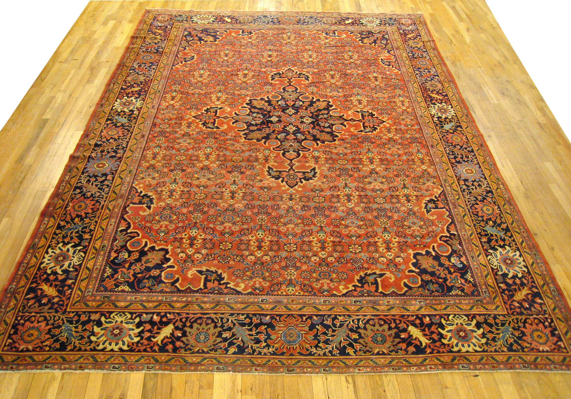 Antique Persian Sultanabad Rug, Room size, circa 1910

A one-of-a-kind antique Persian Sultanabad oriental carpet, hand-knotted with short wool pile. This lovely hand-knotted wool rug features a central medallion on a coral primary field, with a