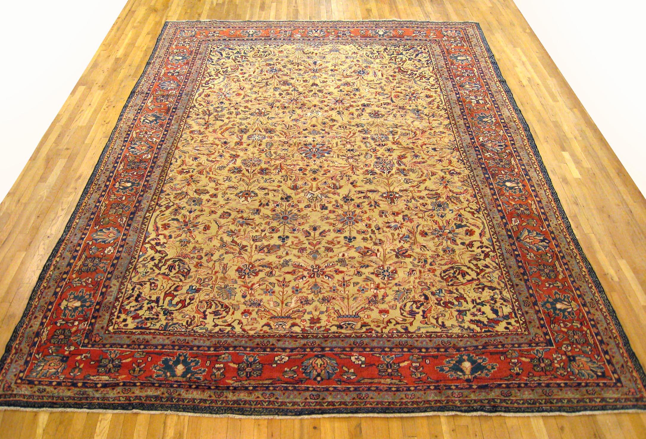 Antique Persian Sultanabad rug, Room size, circa 1900

A one-of-a-kind antique Persian Sultanabad oriental carpet with a thick and lustrous wool pile, knotted by hand, with soft touch and great resistance to wear. This carpet features floral