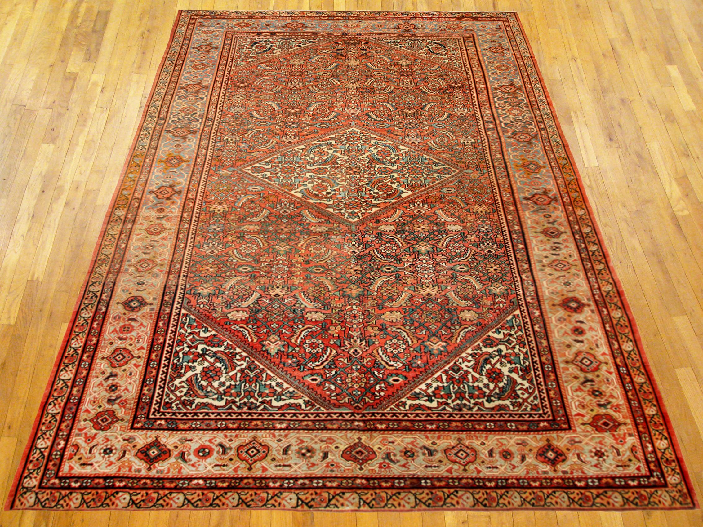 Antique Persan Sultanabad Rug, Room size, circa 1910.

A one-of-a-kind antique Persian Sultanabad oriental carpet, hand-knotted with short wool pile. This lovely hand-knotted wool carpet feaetures a central medallion on a terracotta primary field,