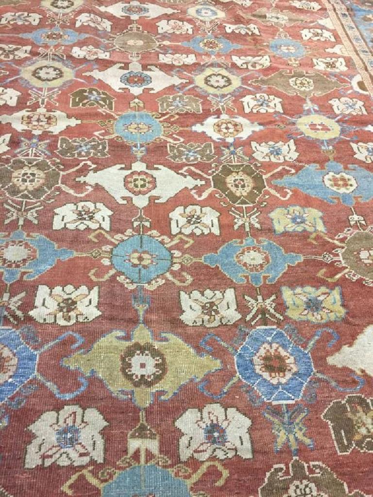 Antique Persian Sultanabad rug, circa 1890, measures: 10'5 x 14'2. The vast majority of Sultanabad carpets feature allover patterns on madder red grounds more or less of floral origin, and spaciously drawn with time-mellowed tones. Sultanabad's are