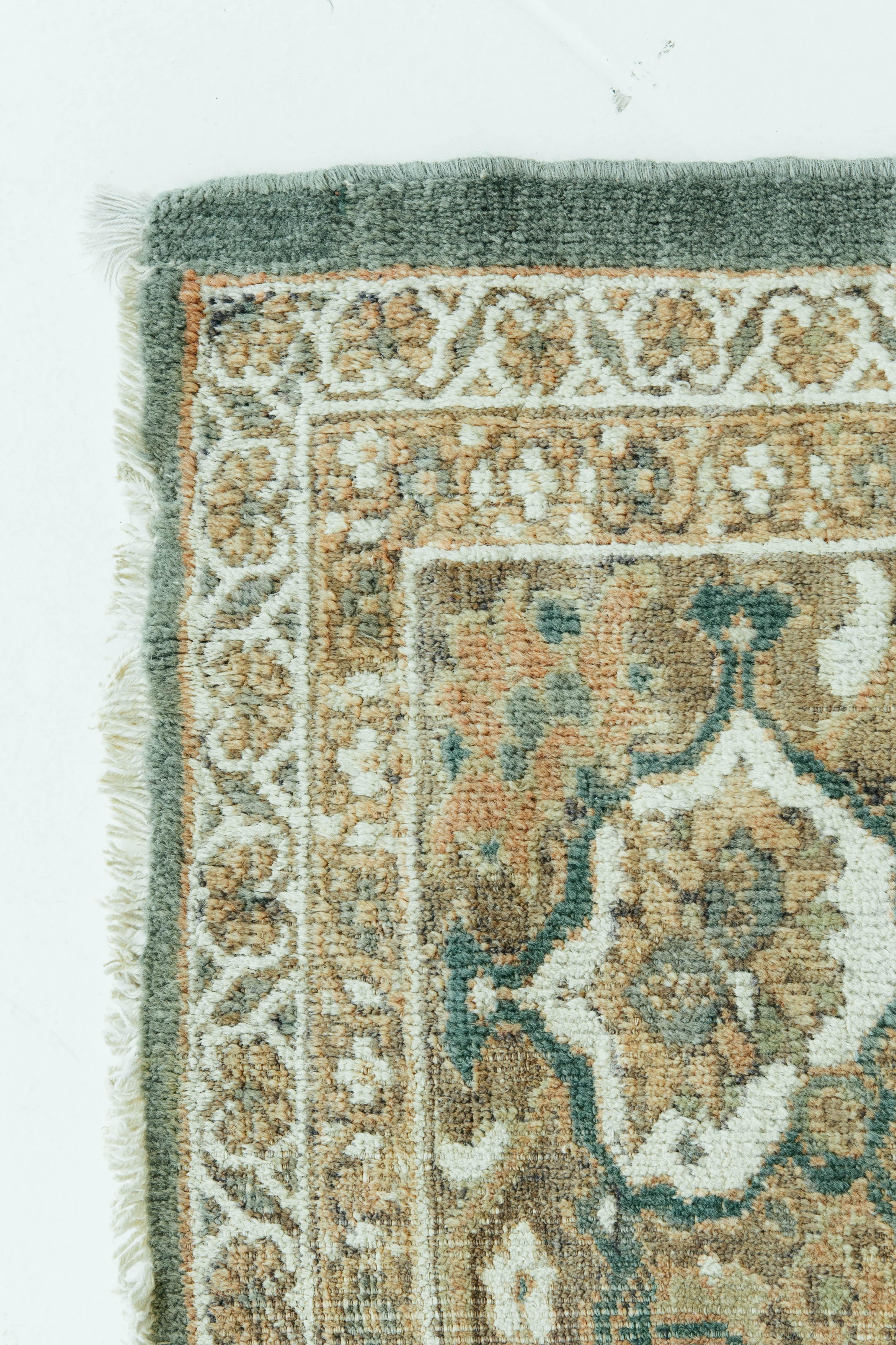 A antique Persian Sultanabad with beautiful floral motifs and a central medallion. Luxurious wool in a soft green and rust color create a cohesive and timely design. Sultanabad in northwest Iran (current day Arak), was a prominent center of village