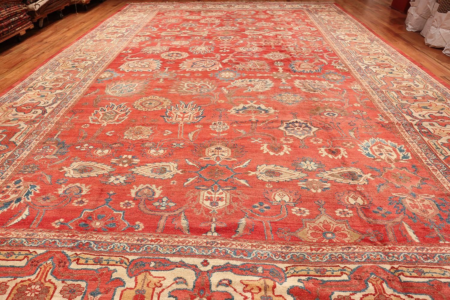 Magnificent Large Oversized Red Antique Persian Sultanabad Rug, Persia, circa Turn of the Twentieth Century. Size: 14 ft x 21 ft (4.27 m x 6.4 m)

This awe inspiring antique Persian Sultanabad rug showcases an outstanding large format all over