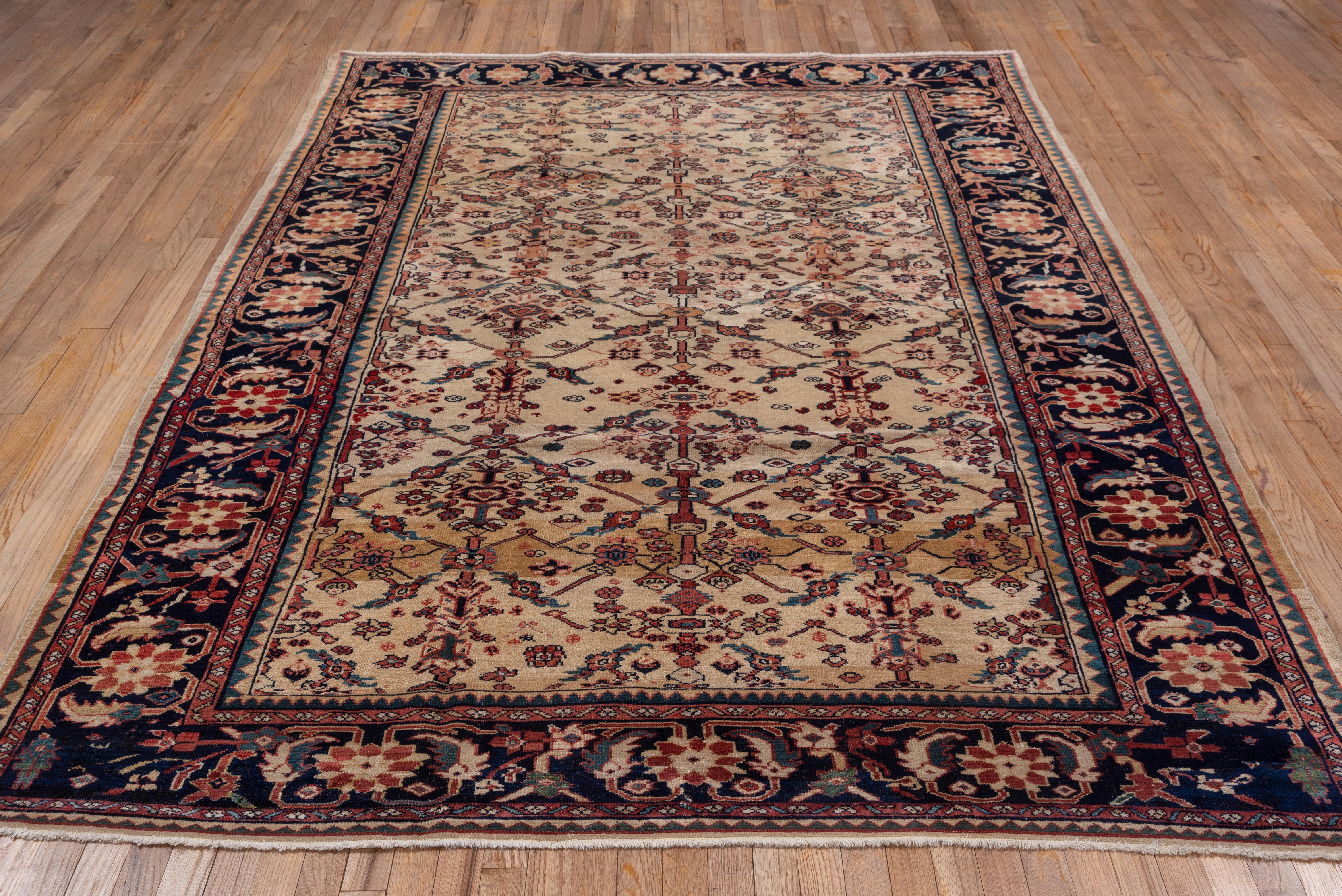 Early 20th Century Antique Persian Sultanabad Rug, Ivory Field, Dark Navy Borders, circa 1900s For Sale