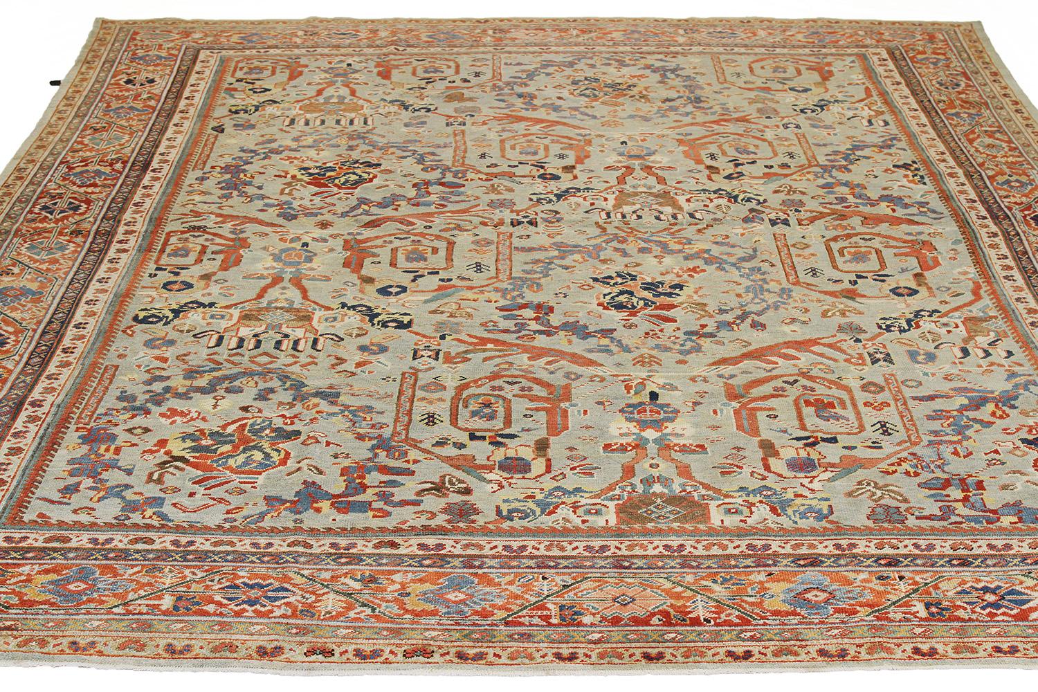 Antique handmade Persian area rug from high-quality sheep’s wool and colored with eco-friendly vegetable dyes that are proven safe for humans and pets alike. It’s a Classic Sultanabad design showcasing a regal ivory field with prominent Herati