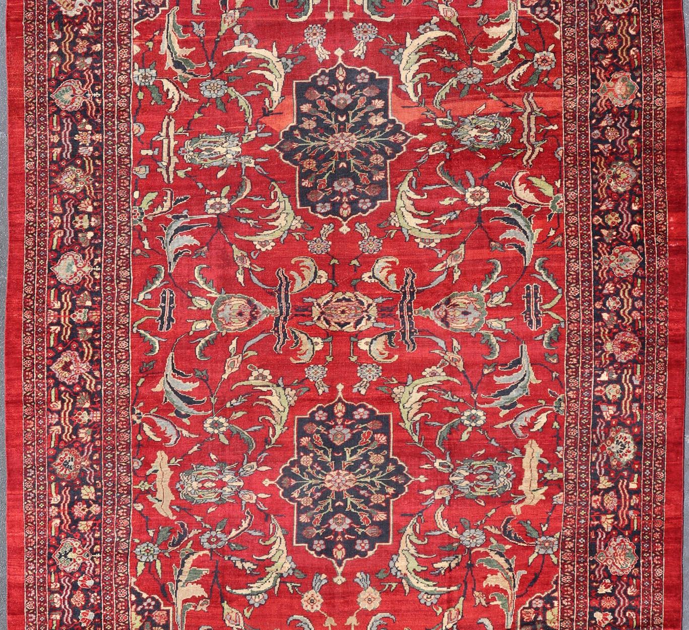 Hand-Knotted Antique Persian Zeigler Sultanabad Rug with Botanical Elements Set on Red Field For Sale