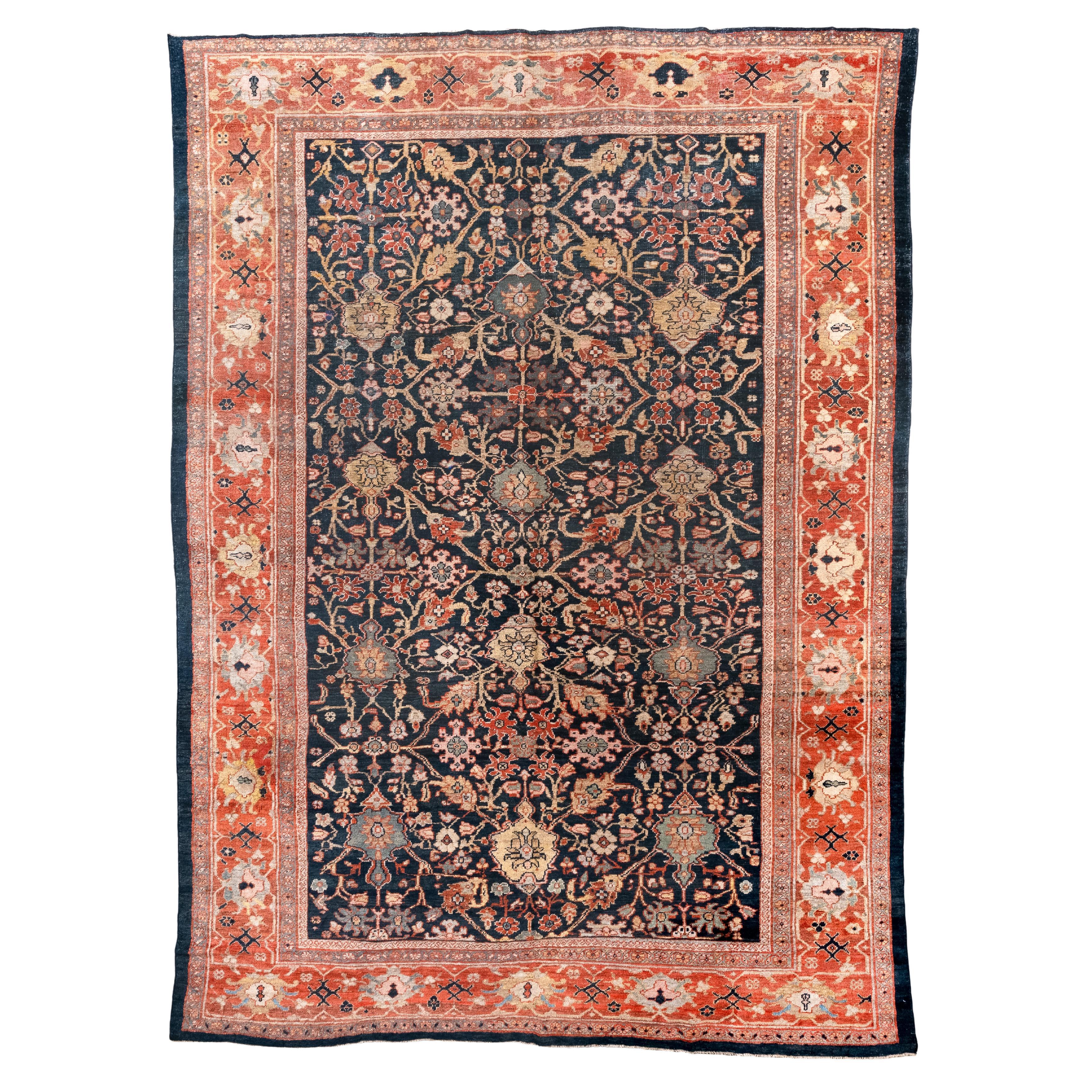 Antiker persischer Sultanabad-Teppich mit floralem Allover-Design und tiefem Indigofeld