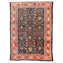Antiker persischer Sultanabad-Teppich mit floralem Allover-Design und tiefem Indigofeld