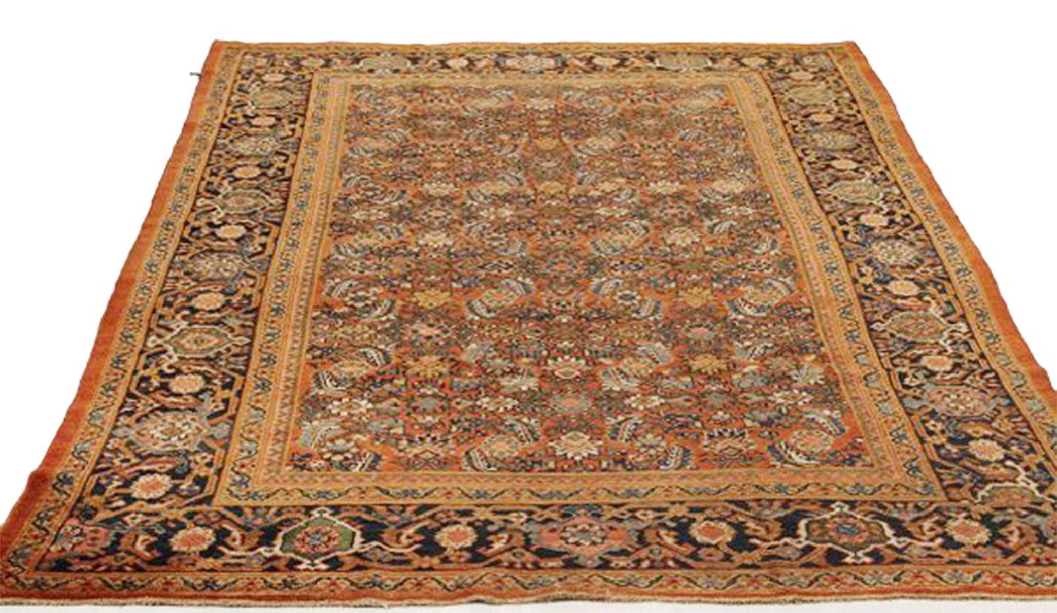 Antique handmade Persian area rug from high-quality sheep’s wool and colored with eco-friendly vegetable dyes that are proven safe for humans and pets alike. It’s a Classic Sultanabad design showcasing an orange and beige field with prominent navy,