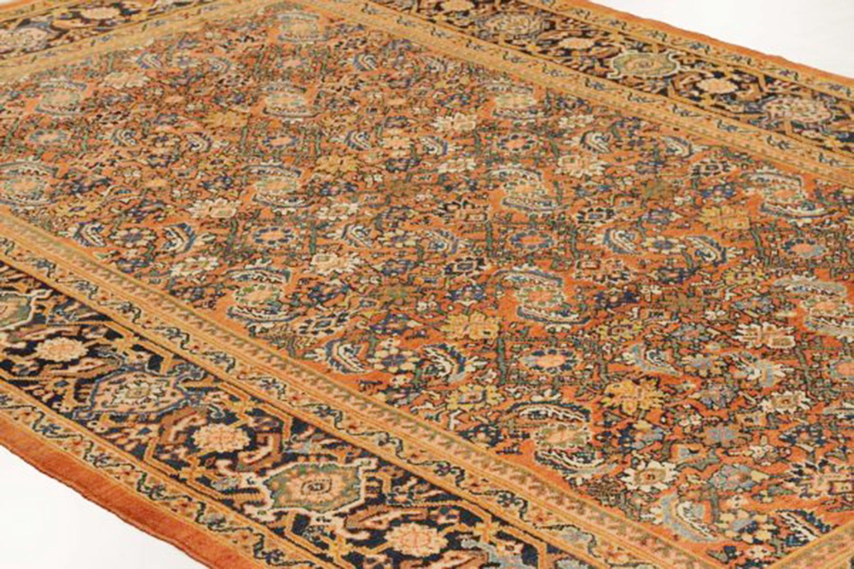 Hand-Woven Antique Persian Sultanabad Rug with Navy and Green Floral Motifs on Orange Field For Sale