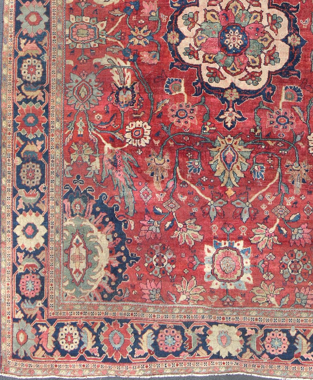 Late 19th century Antique Persian Sultanabad rug with red background, cream large scale medallion and large scale floral motifs, Keivan Woven Arts/ Rug A-1203, country of origin / type: Persian / Sultanabad, circa early-20th century.

Measures: 9' x