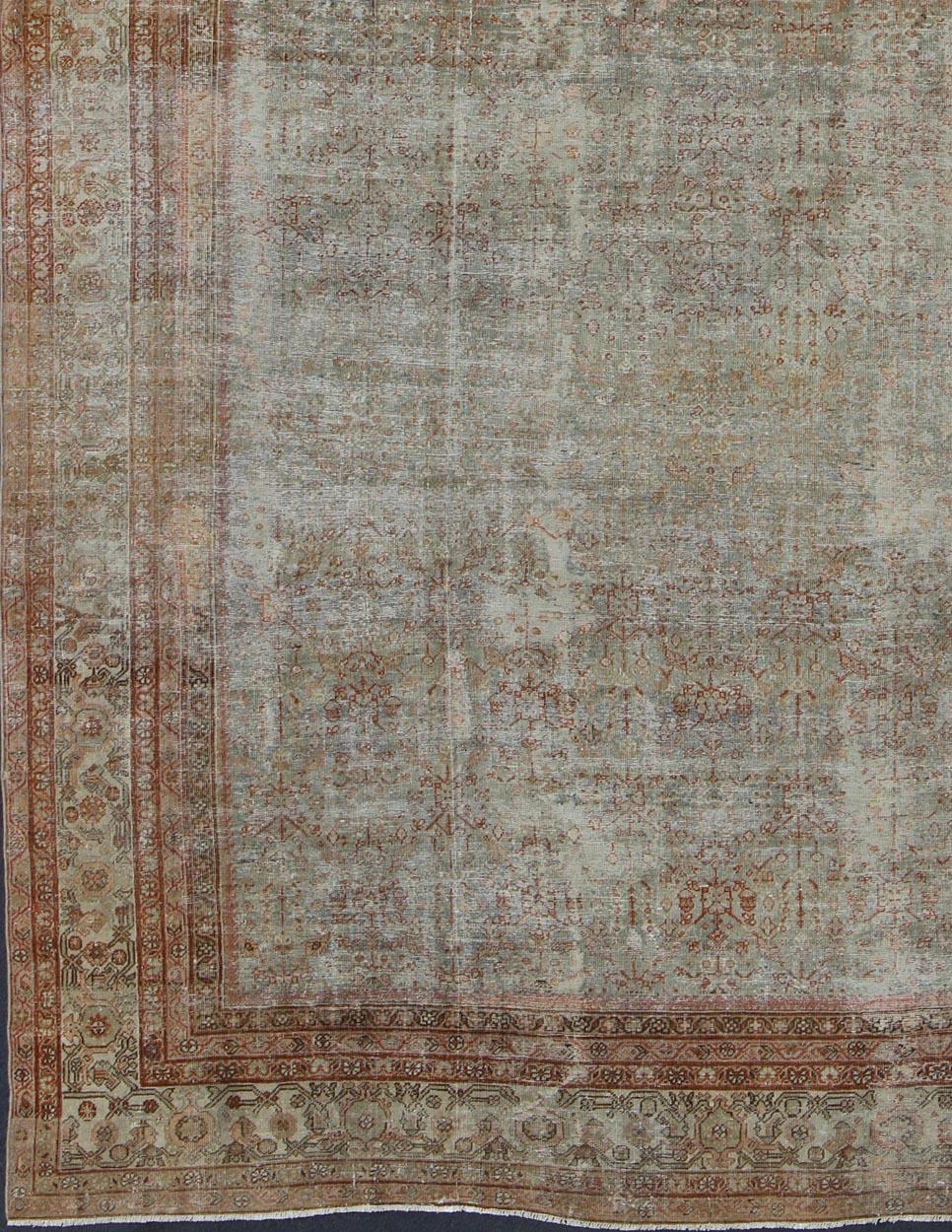 Green and neutrals subdued antique Distressed Persian Sultanabad rug with all-over floral design, rug 16-0917, country of origin / type: Iran / Sultanabad, circa 1900.

This antique Persian Sultanabad Mahal relies heavily on exquisite details. A