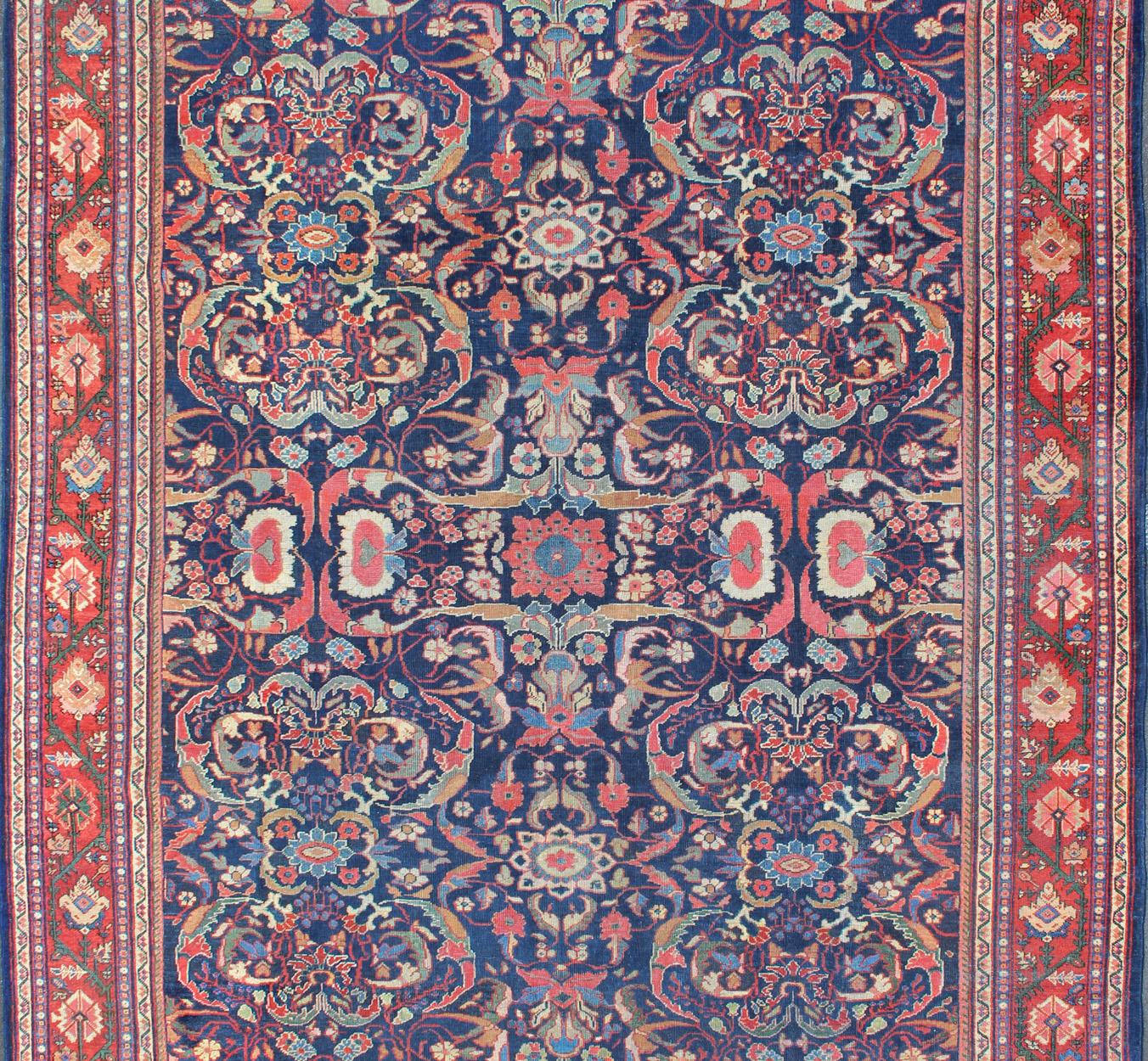Antique Persian Sultanabad in Blue background and colorful field.  Keivan Woven Arts/rug/ B-0536, country of origin / type: Iran / Sultanabad, circa 1910

Measures: 9 x 12'1   

This gorgeous antique Persian Sultanabad rug (circa 1910s) relies