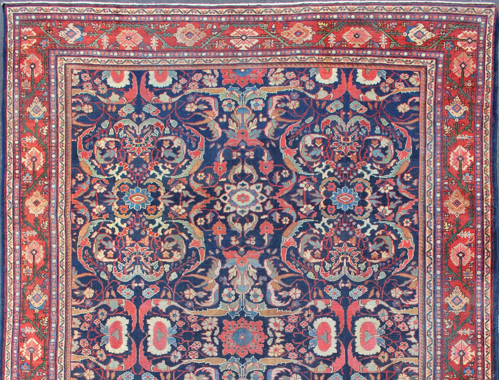 Hand-Knotted Colorful Antique Persian Sultanabad Rug with Navy Blue Field and Red Border For Sale