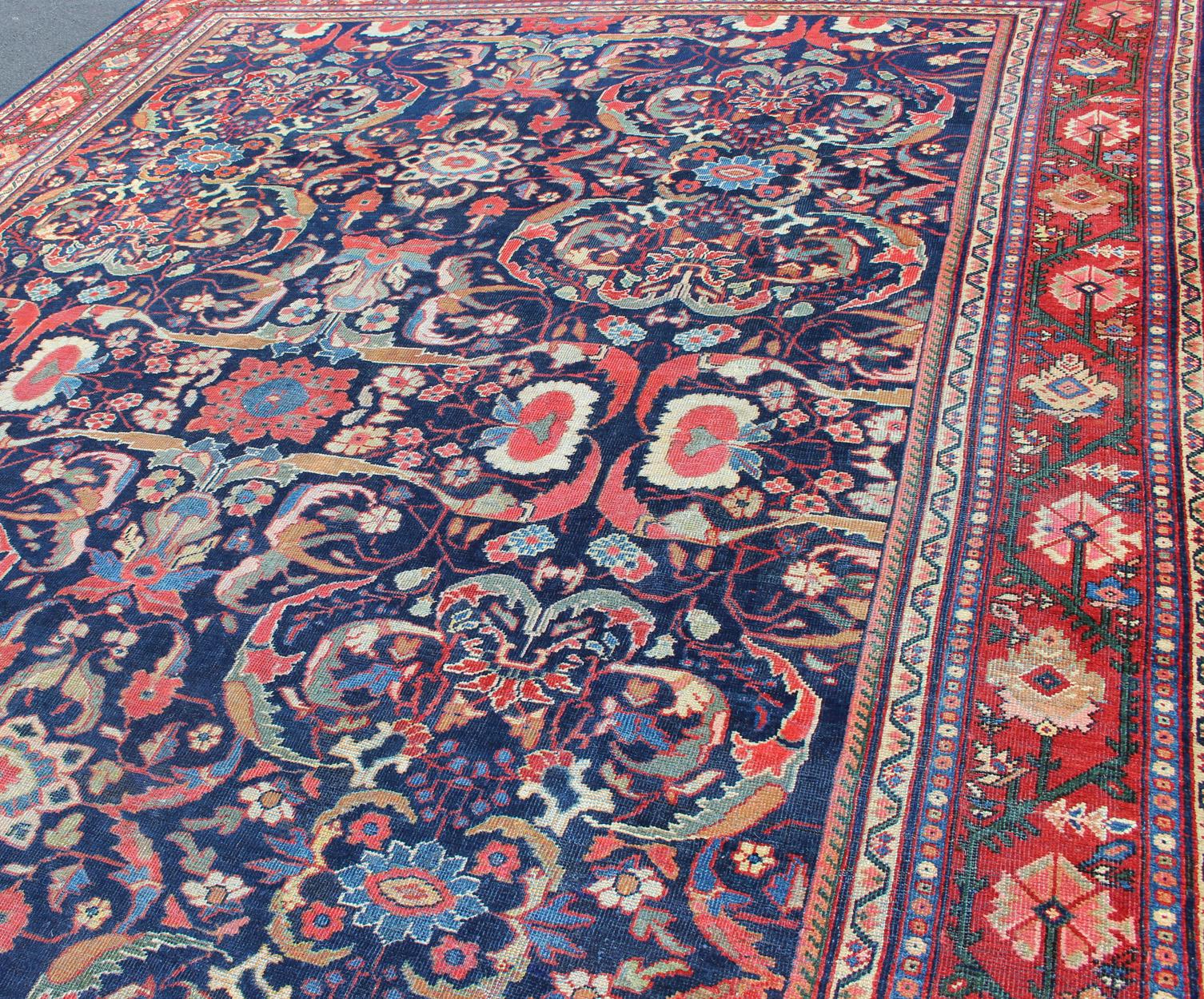 Colorful Antique Persian Sultanabad Rug with Navy Blue Field and Red Border In Good Condition For Sale In Atlanta, GA