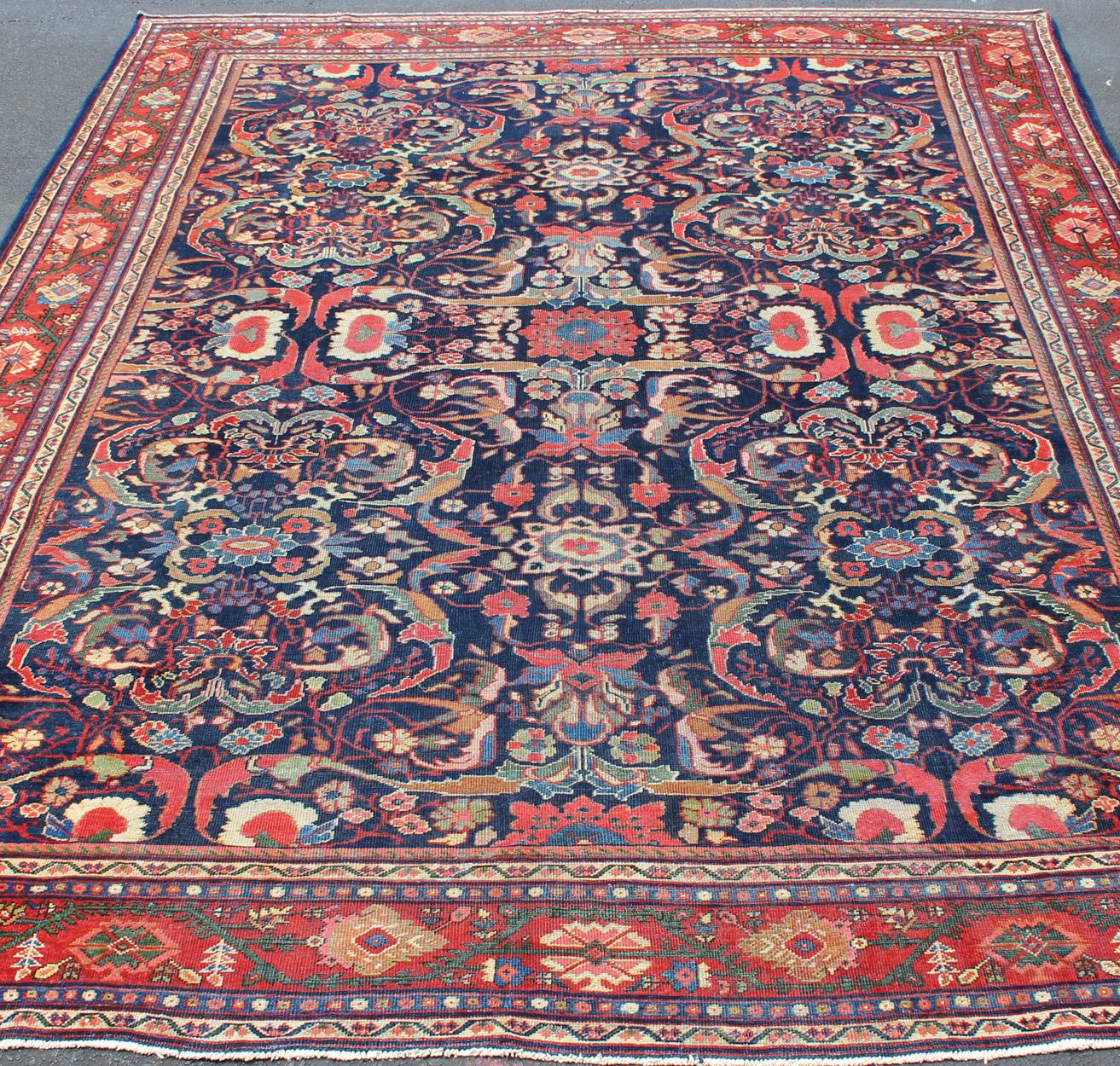 Early 20th Century Colorful Antique Persian Sultanabad Rug with Navy Blue Field and Red Border For Sale