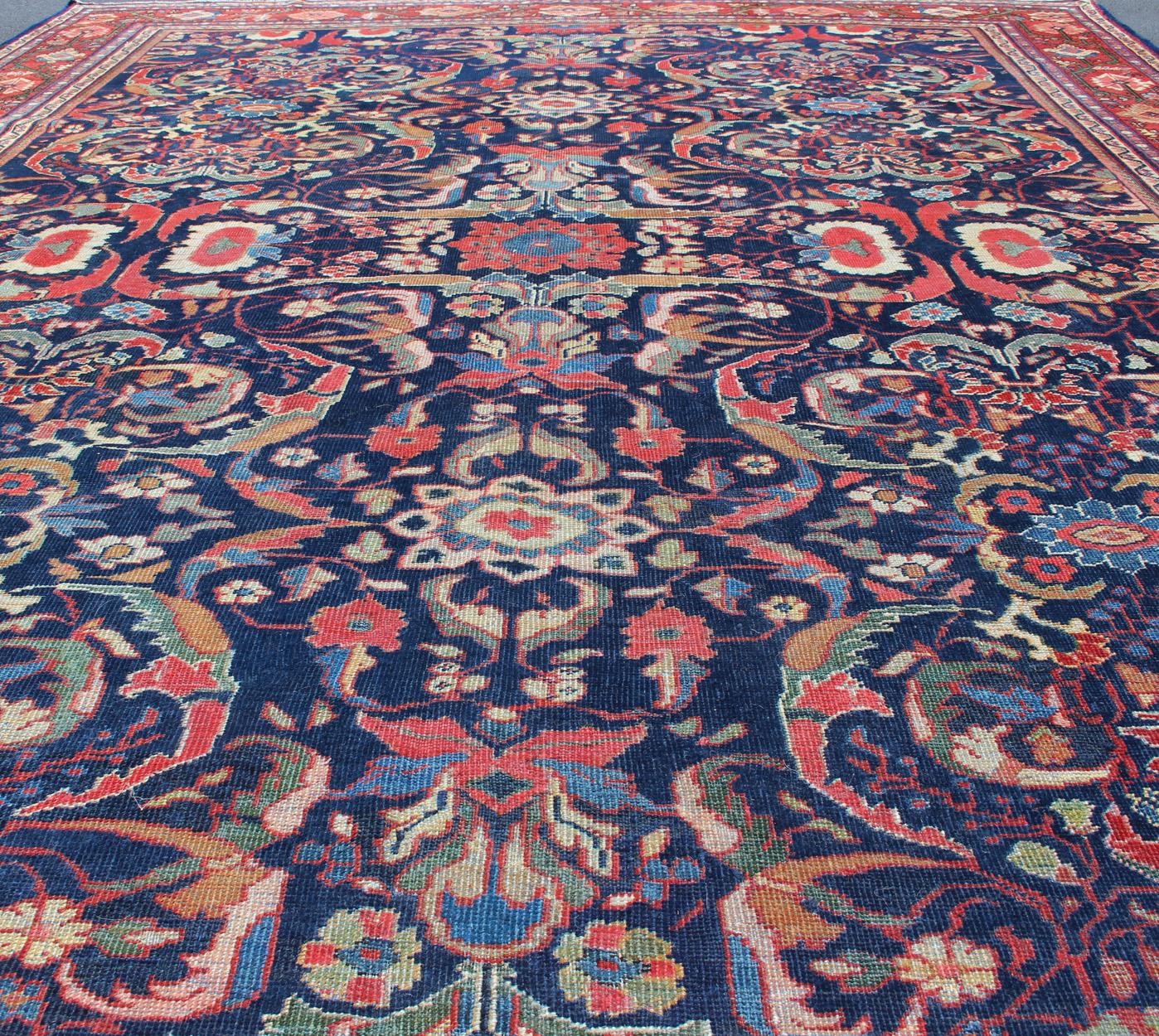 Wool Colorful Antique Persian Sultanabad Rug with Navy Blue Field and Red Border For Sale