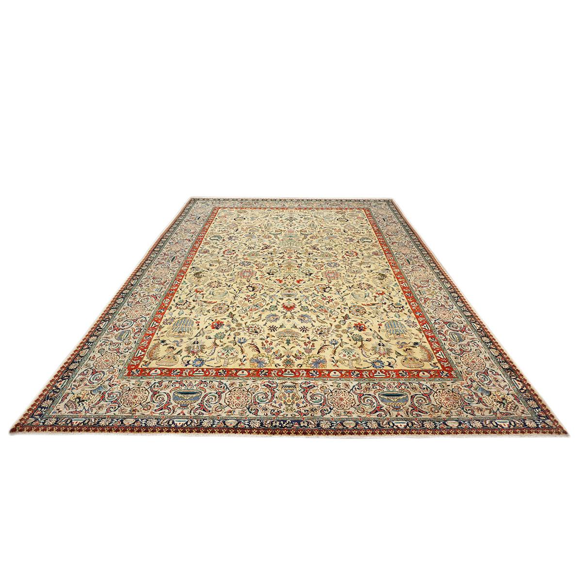 Ashly Fine Rugs presents a 1940s Antique Persian Tabriz. Tabriz is a northern city in modern-day Iran and has forever been famous for the fineness and craftsmanship of its handmade rugs. This piece has a light gold-colored background with design,