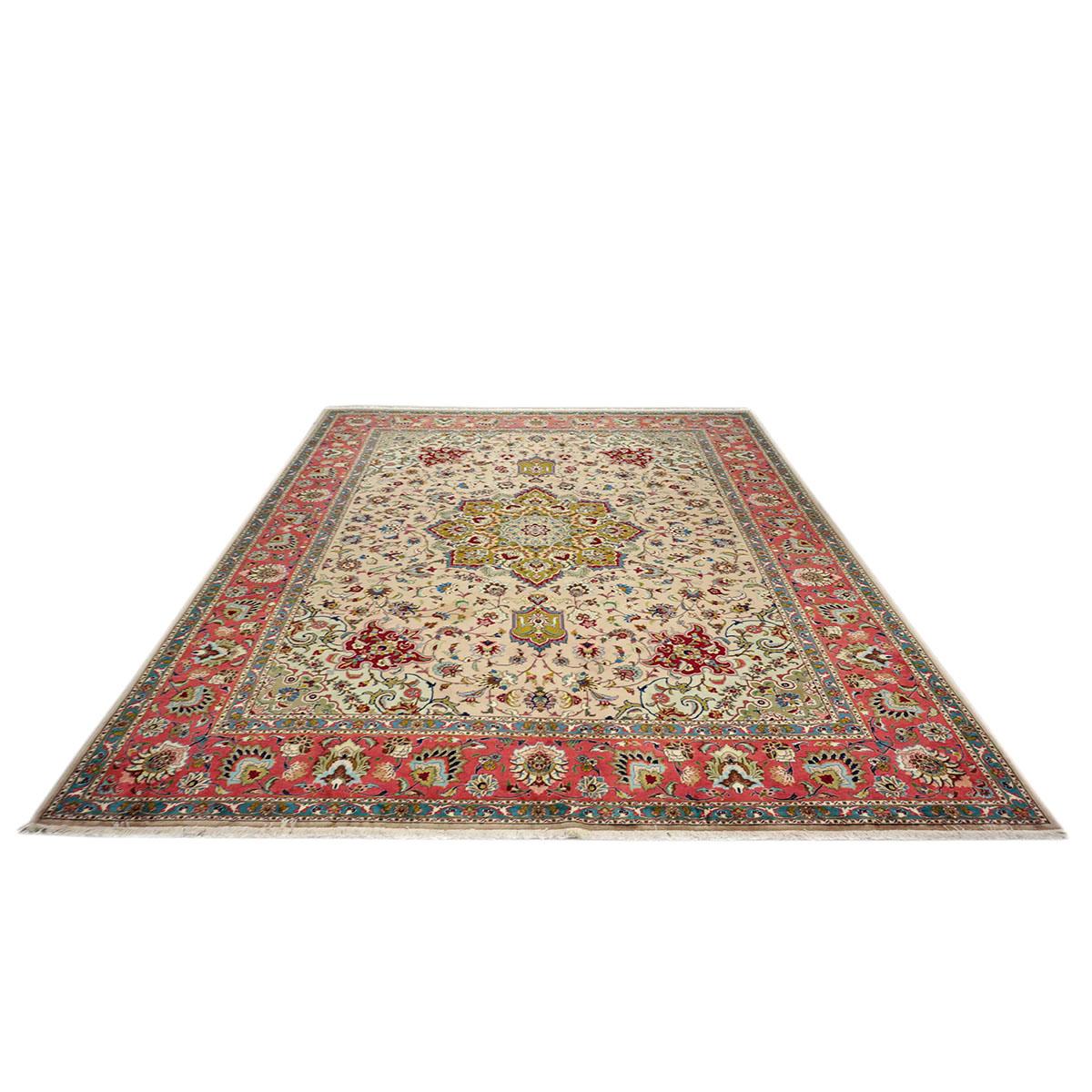 Ashly Fine Rugs presents a 1940s Antique Persian Tabriz. Tabriz is a northern city in modern-day Iran and has forever been famous for the fineness and craftsmanship of its handmade rugs. This piece has a light bone-colored background with design,