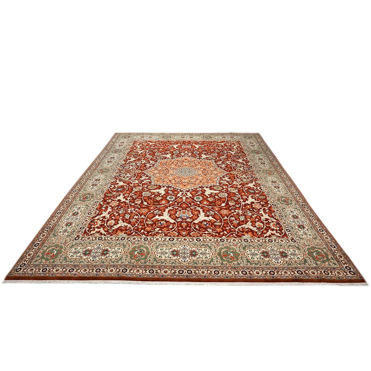 Ashly fine rugs presents a 1940s Antique Persian Tabriz. Tabriz is a northern city in modern-day Iran and has forever been famous for the fineness and craftsmanship of its handmade rugs. This piece has a dark red-colored background, with the design,