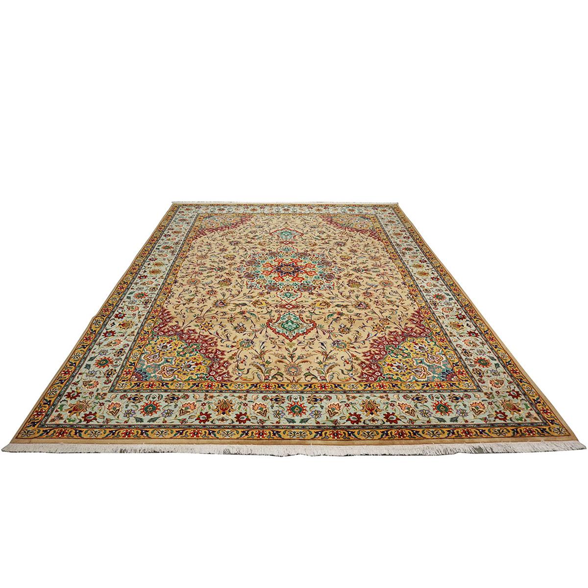 Ashly fine rugs presents a 1940s Antique Persian Tabriz. Tabriz is a northern city in modern-day Iran and has forever been famous for the fineness and craftsmanship of its handmade rugs. This piece has a light sand-colored background, with the